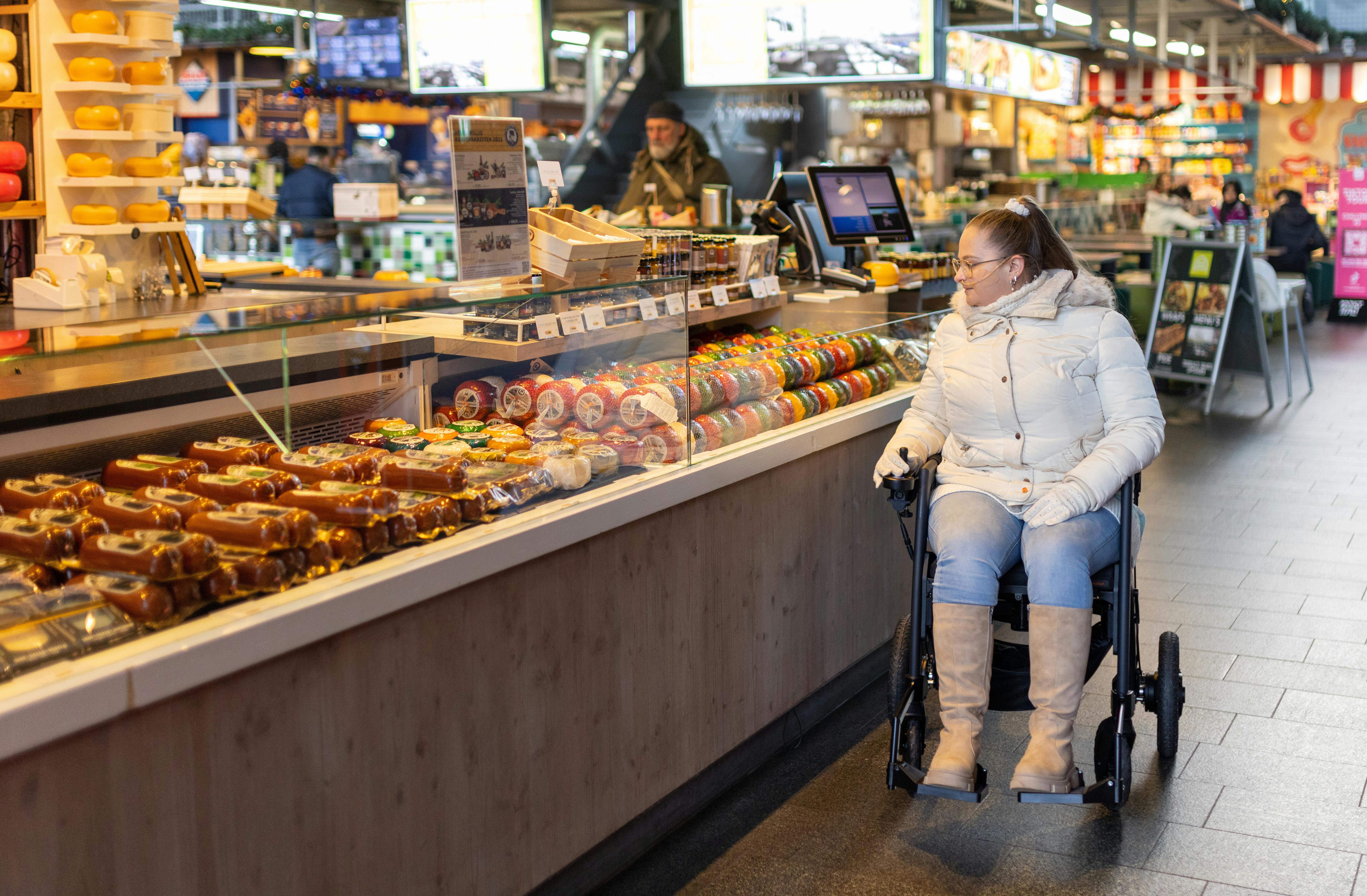 Natalie cruises down a Walmart aisle in her wheelchair | Source: Pexels