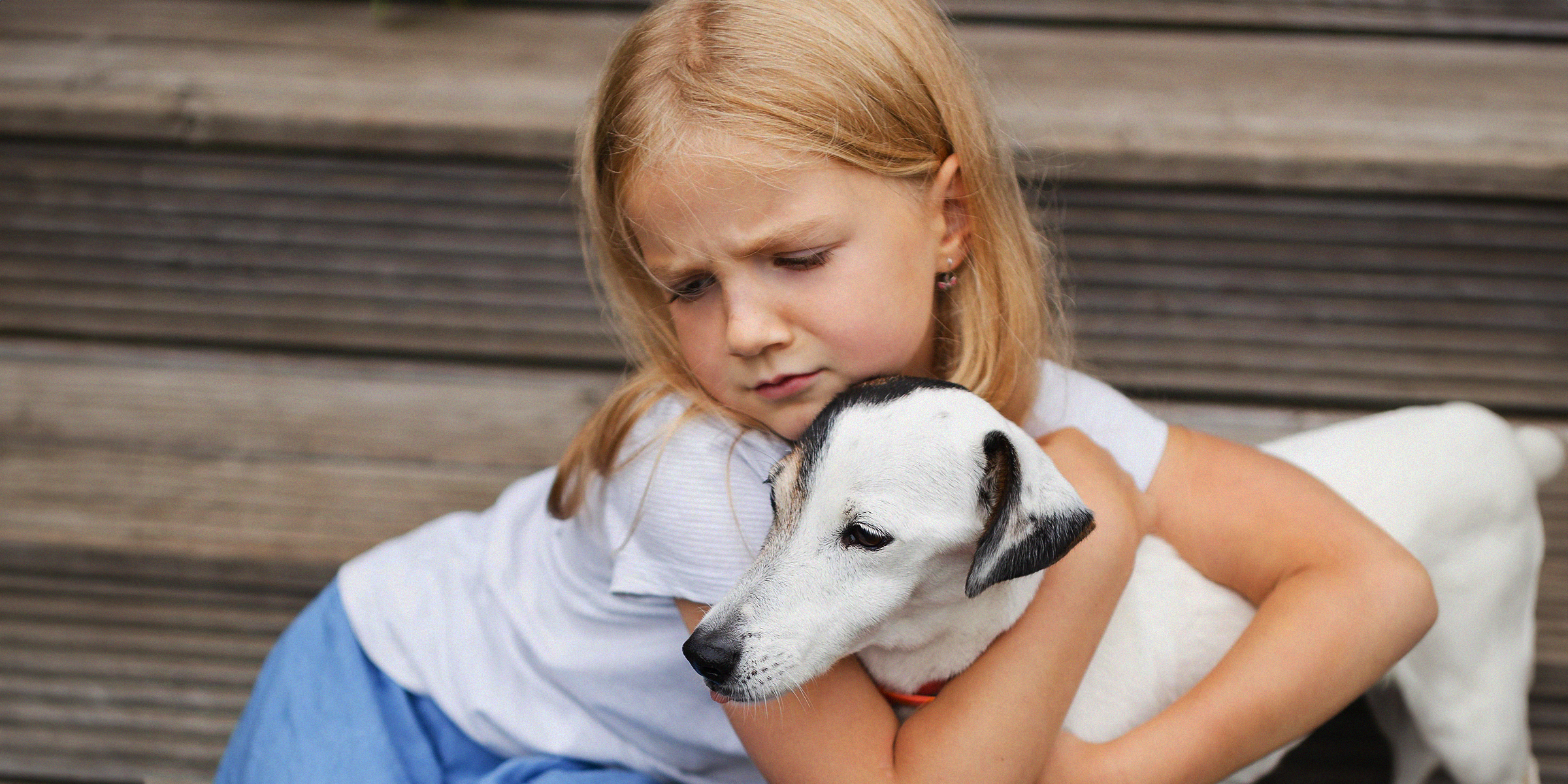 A girl with a puppy | Source: freepik.com