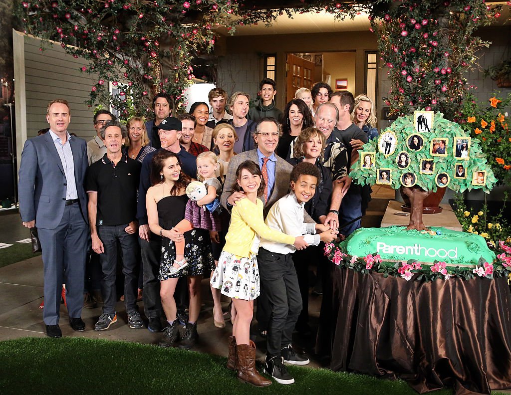 The cast of 'Parenthood' pose at NBC's 'Parenthood' 100th episode cake-cutting ceremony at Universal Studios on November 7, 2014 | Photo: Getty Images