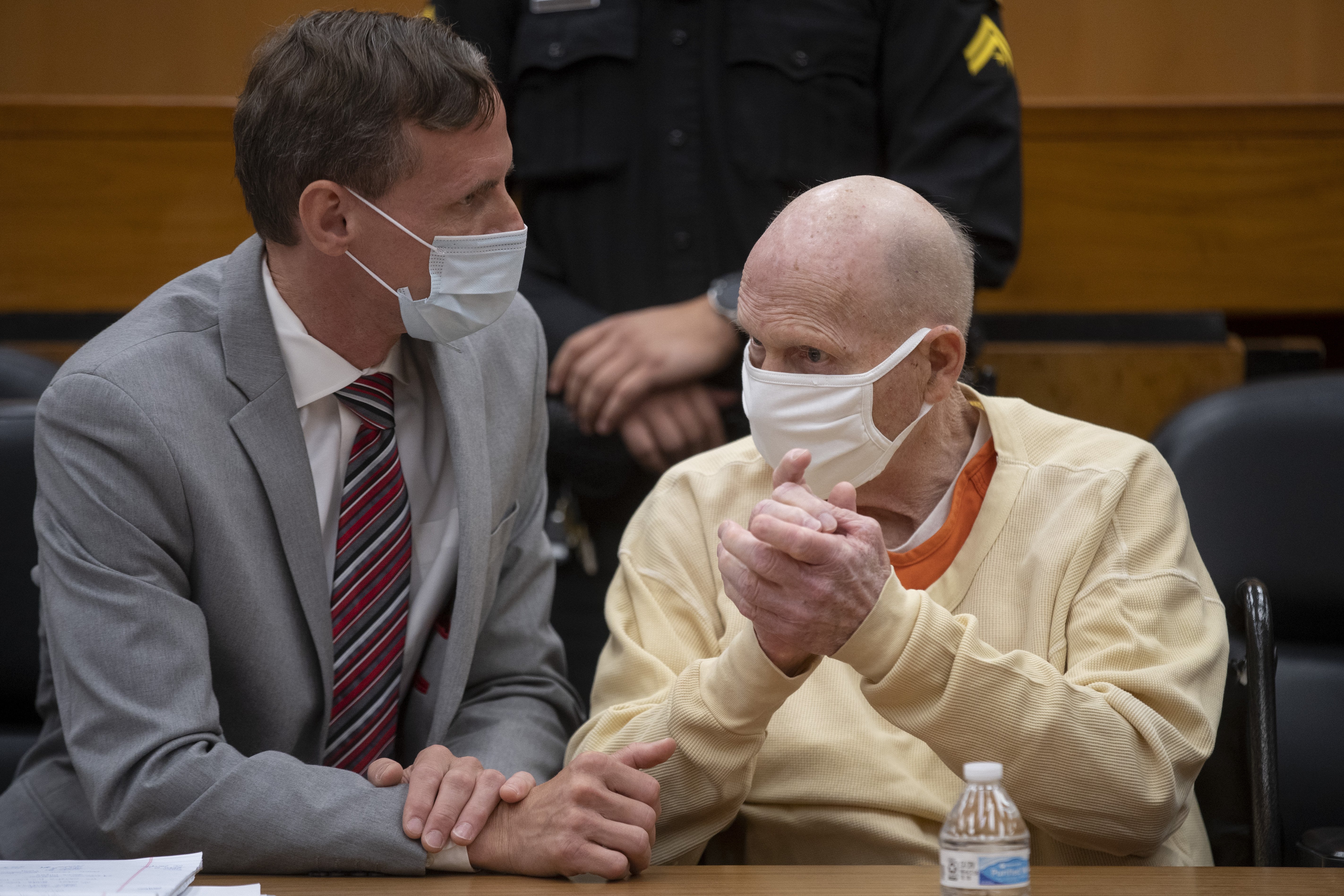 Joseph James DeAngelo (right) is photographed as he speaks with public defender Joseph Cress at the end of the second day of victim impact statements at the Gordon D. Schaber Sacramento County Courthouse on Wednesday, August 19, 2020, in Sacramento, California. | Source: Getty Images