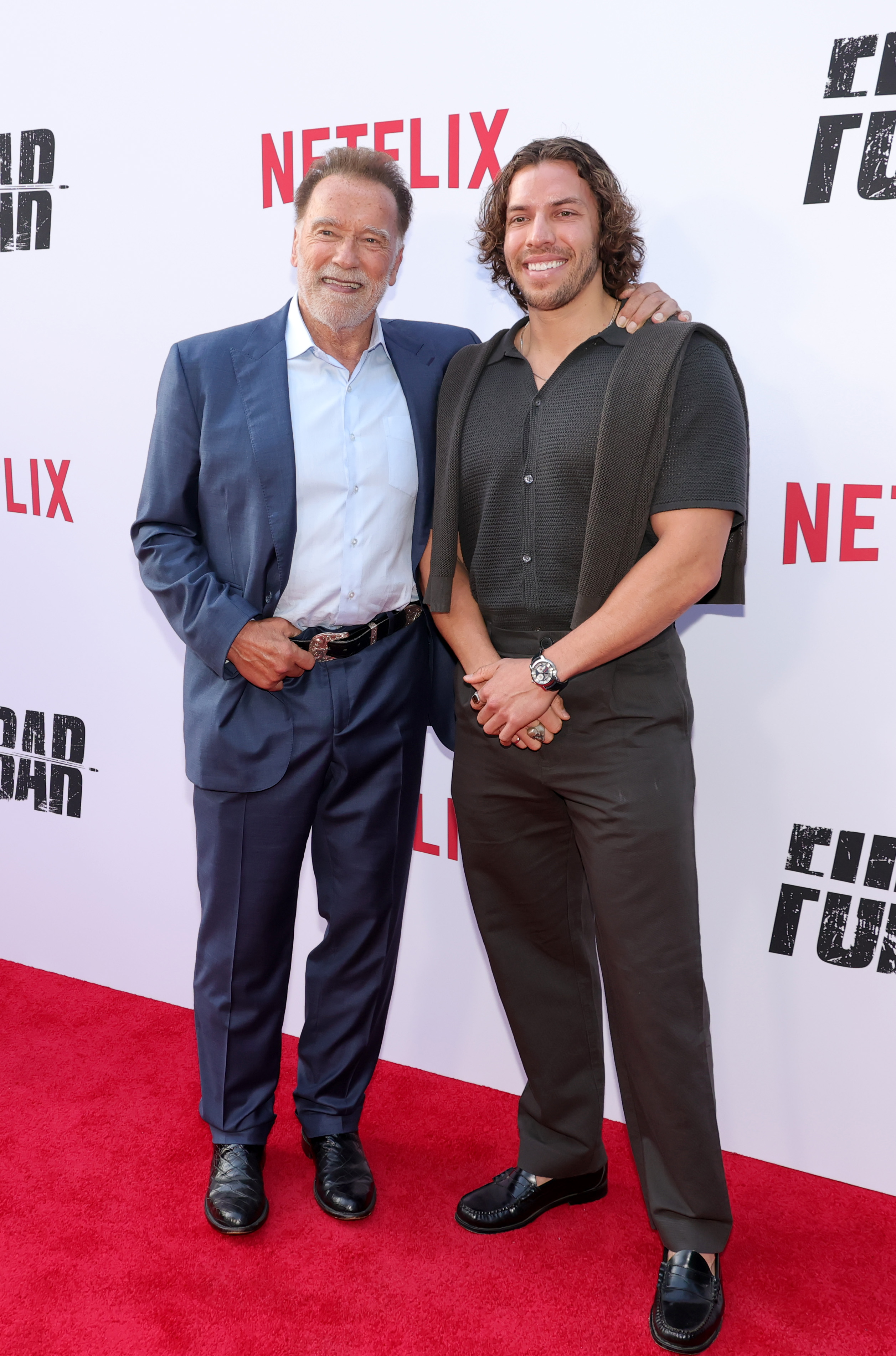 Arnold Schwarzenegger and Joseph Baena at Netflix's Los Angeles premiere of "Fubar" Season 2 on June 11, 2025. | Source: Getty Images