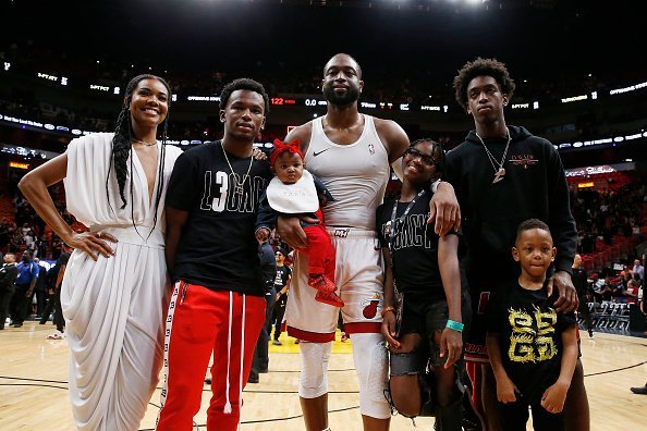 Dwyane Wade, his wife, Gabrielle Union, nephew, Dahveon Morris, and children, Kaavia James Union Wade, Zaire Wade, Xavier Wade and Zion Wade at American Airlines Arena in Miami.| Photo: Getty Images.