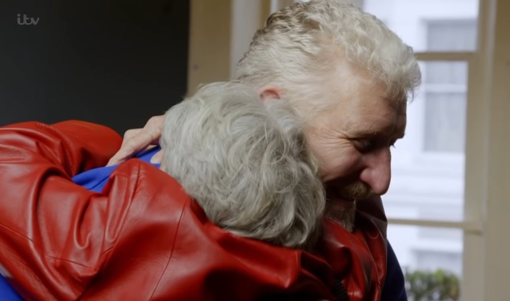 Picture of Bronwen Hook and her long lost son, Mark, hugging each other during their reunion. | Source: Youtube/ITV