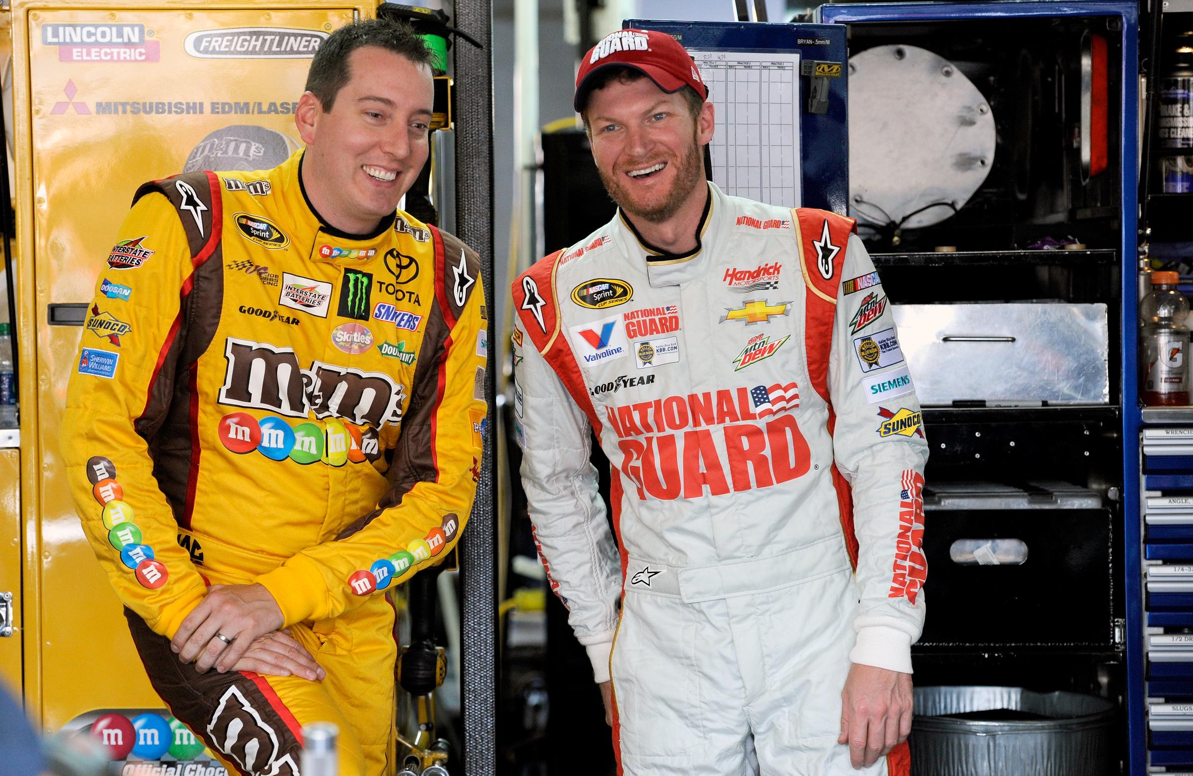 Kyle Busch and Dale Earnhardt Jr. during practice for the NASCAR Sprint Cup Series Coca-Cola 600 in Charlotte, North Carolina on May 22, 2014. | Source: Getty Images