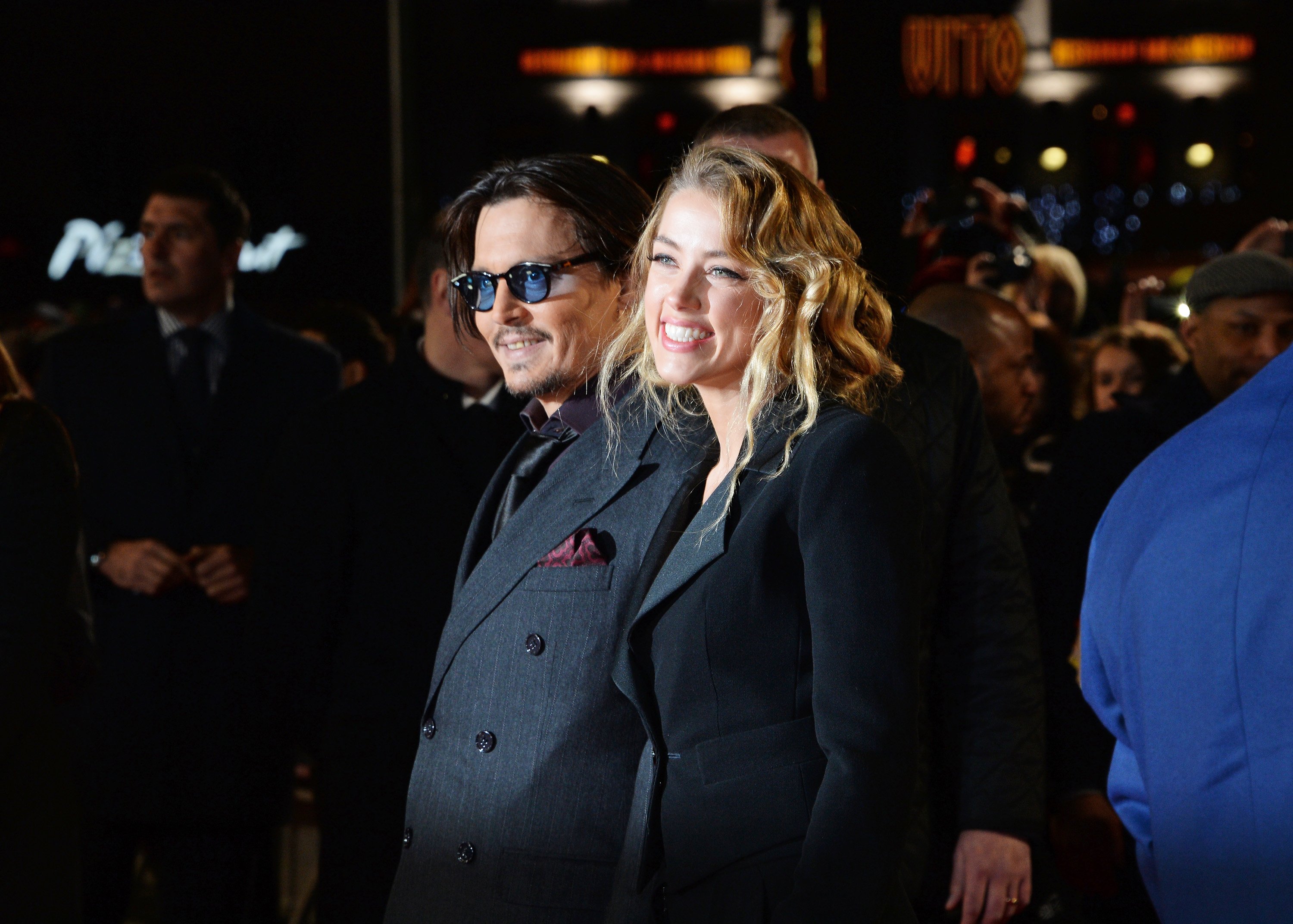 Johnny Depp and Amber Heard attend the UK Premiere of "Mortdecai" at Empire Leicester Square on January 19, 2015, in London, England. | Source: Getty Images