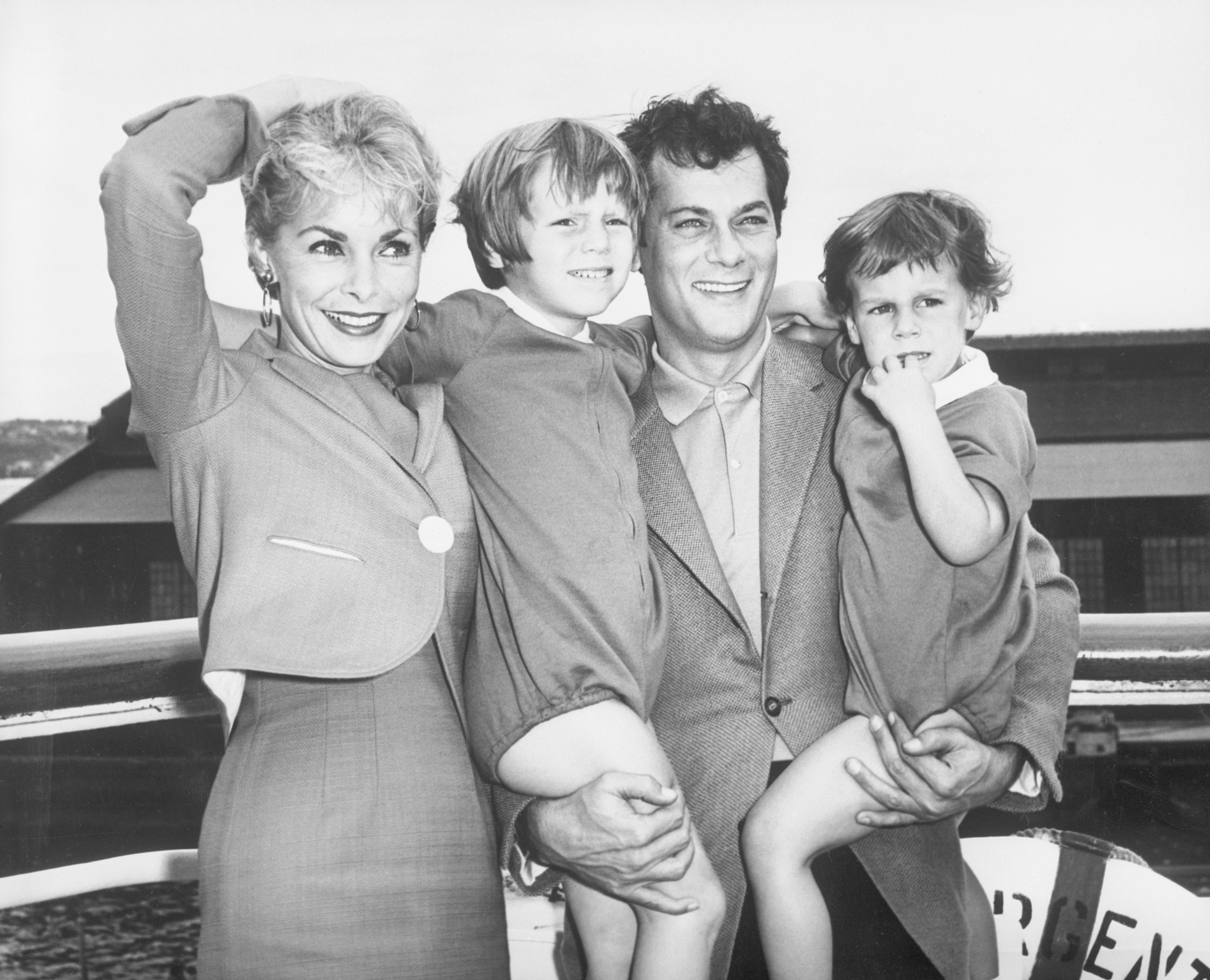 Tony Curtis and Janet Leigh with their children, Kelly, 5, and Jamie, 2 1/2, pose prior to their departure on the S.S. Argentina for Argentina, where Curtis filmed "Taras Bulba" on September 15, 1961, in New York City | Source: Getty Images