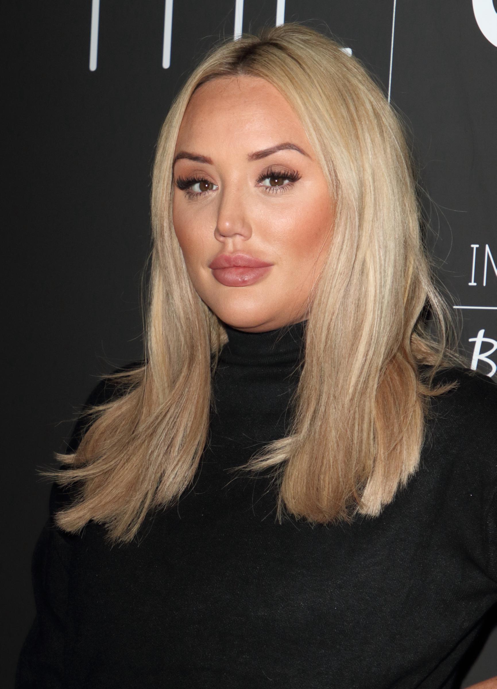 At the In The Style x Billie Faiers Launch at STK London on 18 November 2019, Crosby served chic sophistication, stepping out in a sleek black high-neck dress and polished blonde locks that framed her face with elegance.