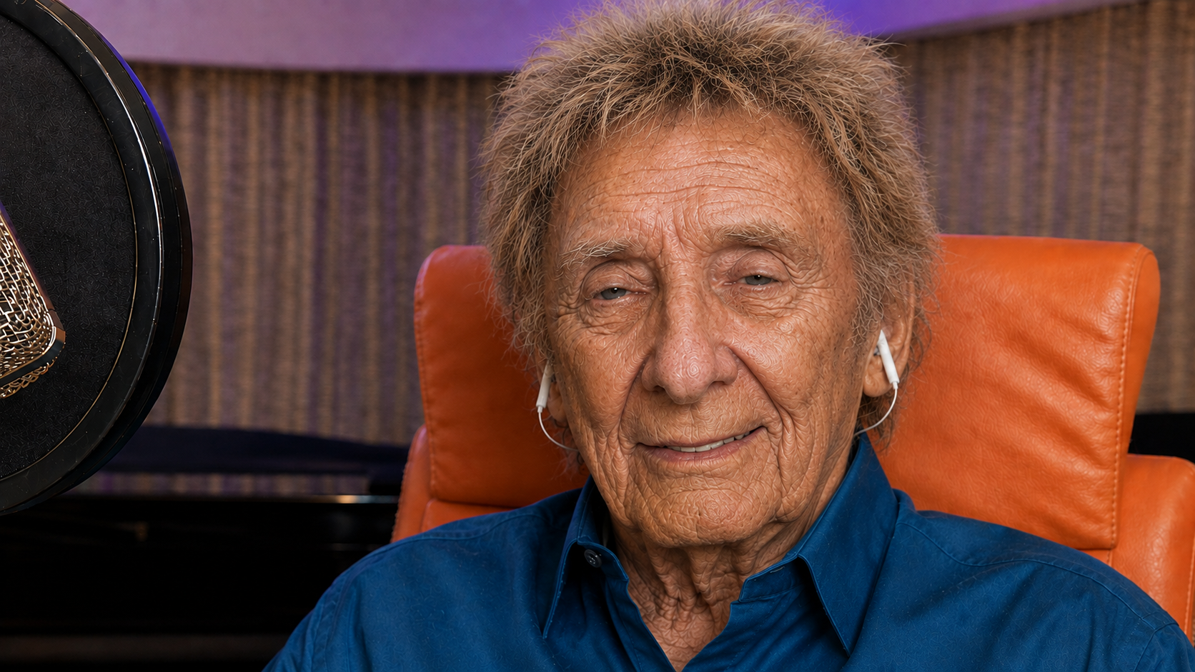 This seated image has a more relaxed feel than the concert shots. Without a large stage around him, the imagined older appearance reads more like an everyday portrait than a performance image. | Source: ChatGPT