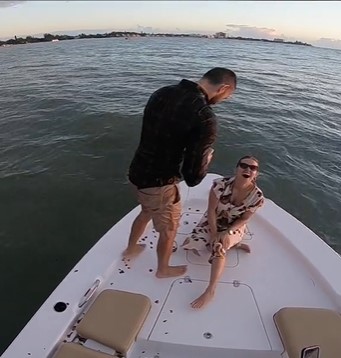 A soaking wet Scott Clyne back on the boat to retry popping the big question | Source: TikTok/humankind