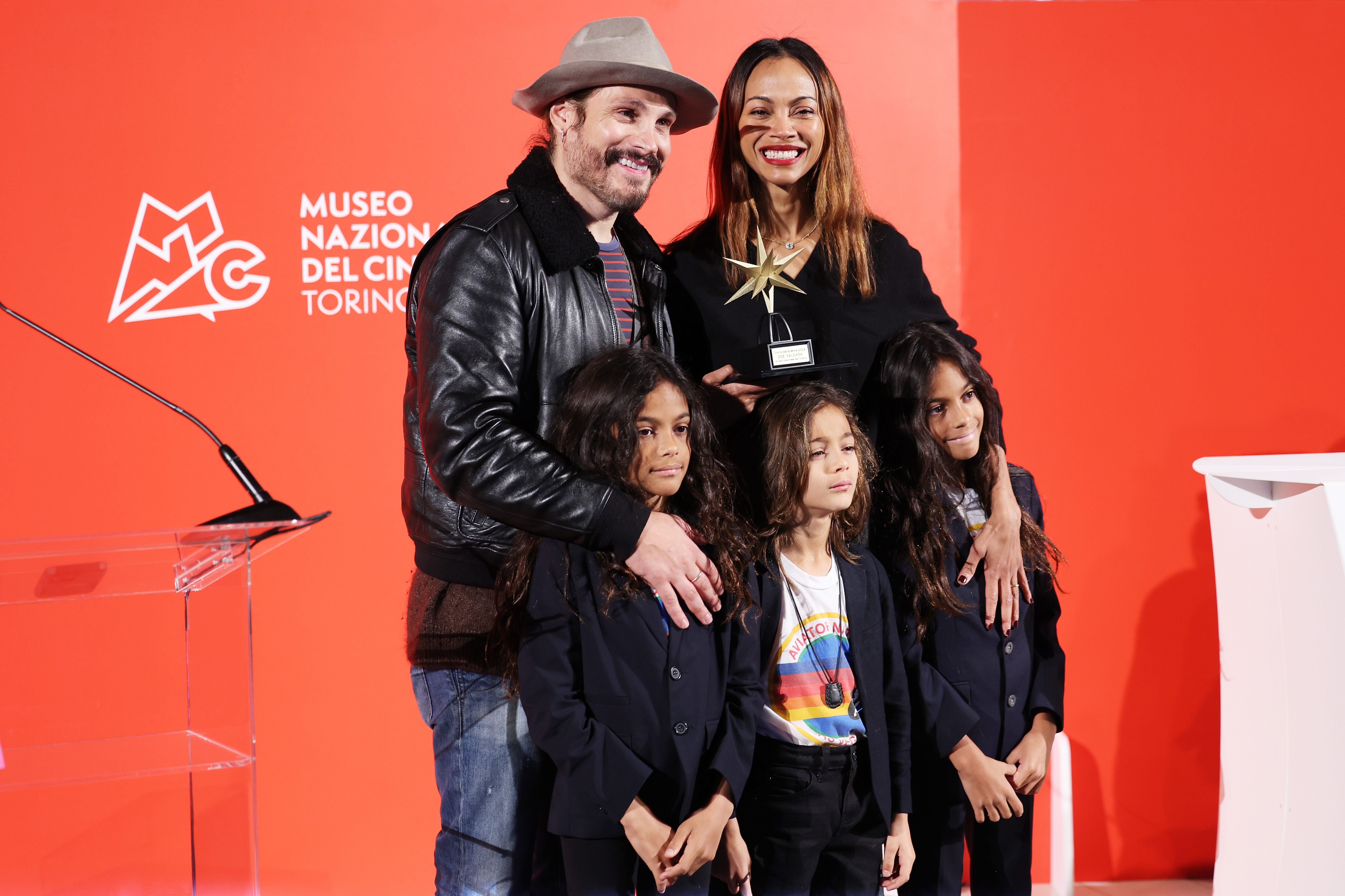 Marco Perego and Zoe Saldaña with their kids Cy, Bowie, and Zen Perego-Saldaña. | Source: Getty Images