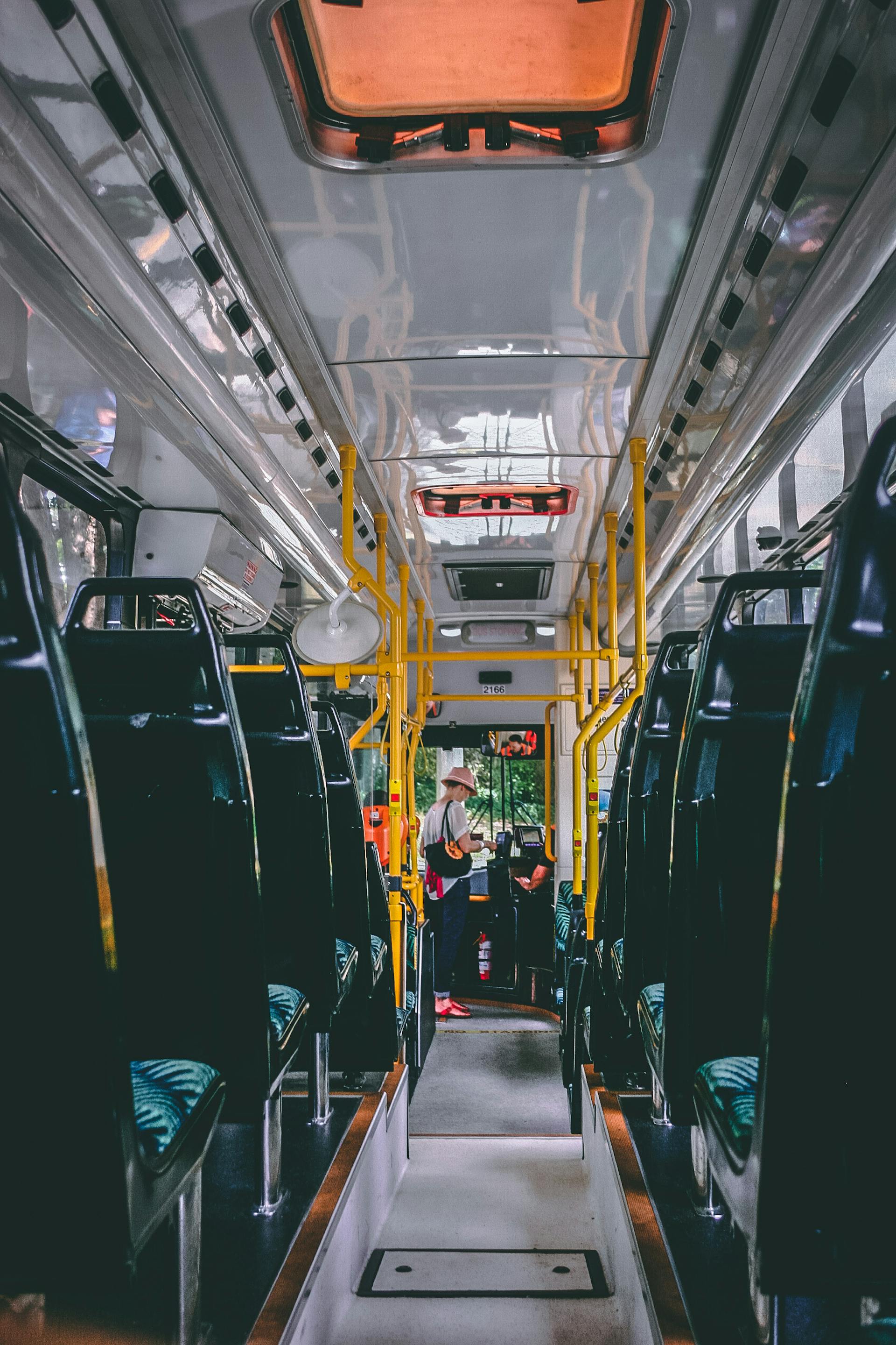 A woman standing in a bus | Source: Pexels