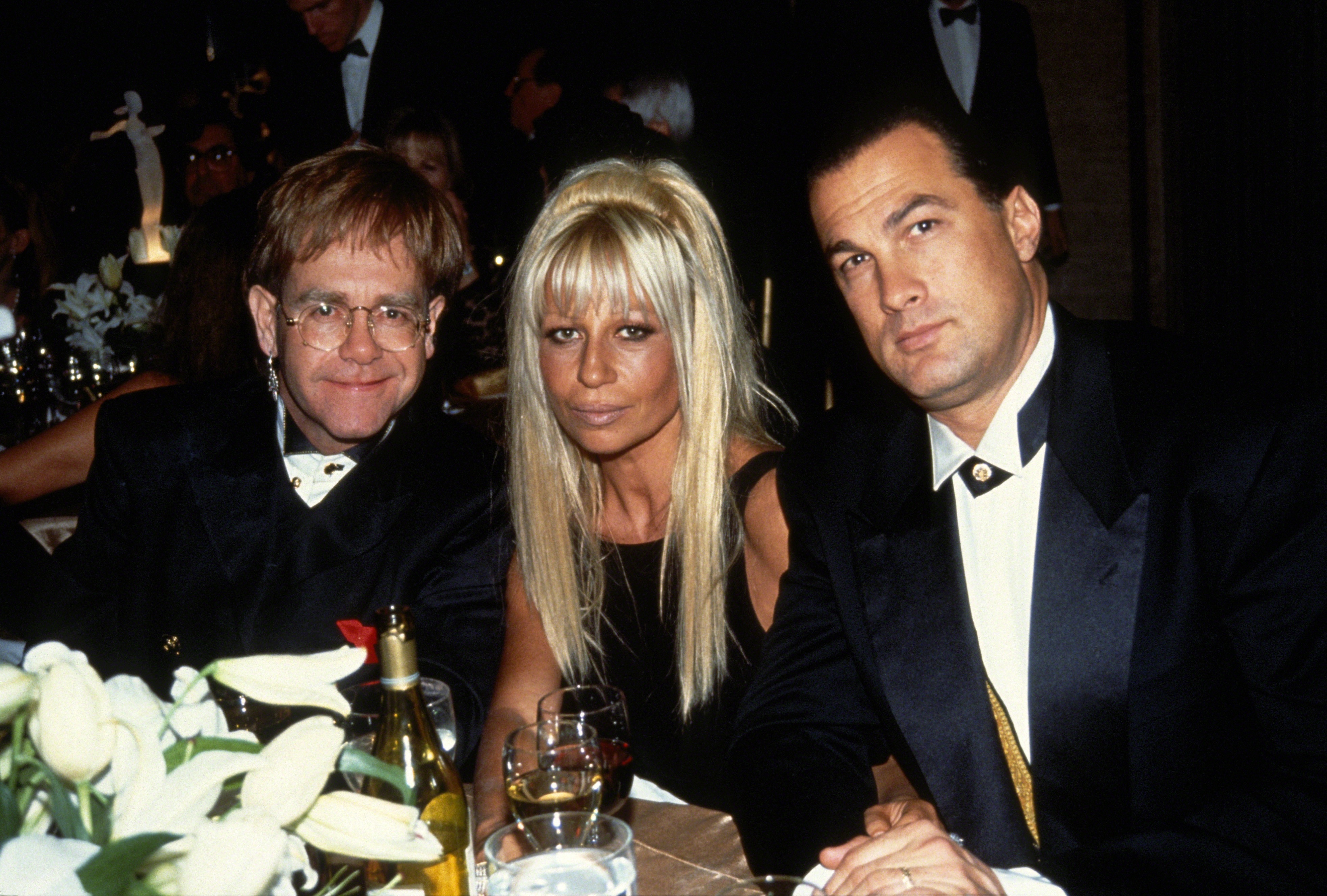 Elton John, Donatella Versace and Steven Seagal attend the 12th Annual Council of Fashion Designers of America (CFDA) Awards, circa 1993 in New York City | Source: Getty Images