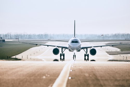 An airplane taxing on the tarmac. | Source: Shutterstock.