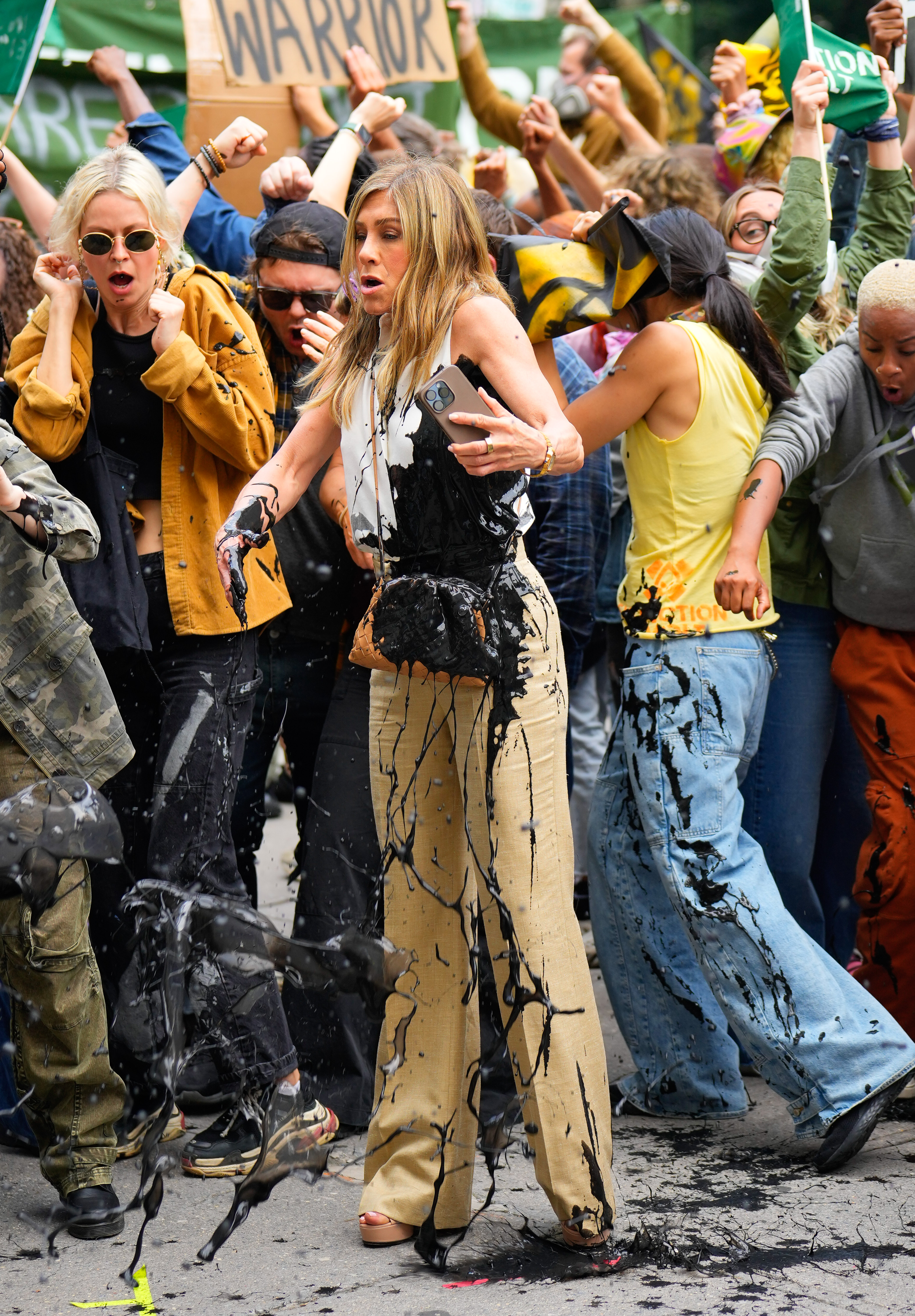 Jennifer Aniston reacts as black oil splashes on her in the Flatiron District of New York City on July 28, 2024 | Source: Getty Images