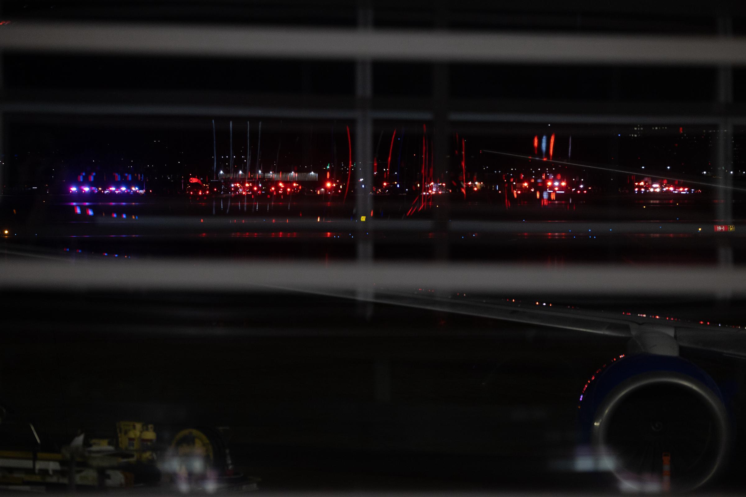 A view of emergency response vehicles at Ronald Reagan National Airport following a collision between an American Airlines flight and an Army helicopter in Washington, D.C. on January 30, 2025. | Source: Getty Images