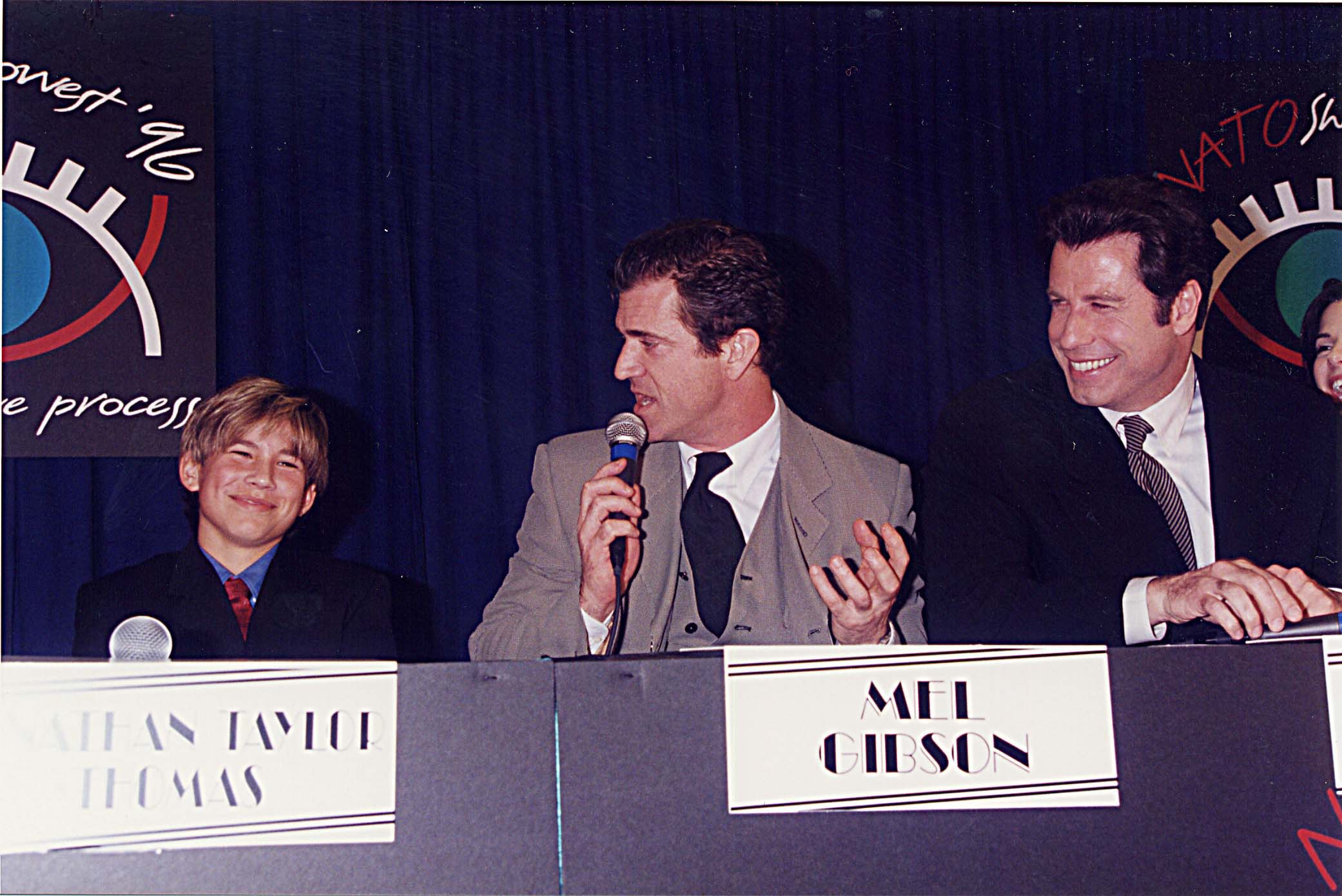 Jonathan Taylor Thomas, Mel Gibson & John Travolta during ShoWest '96 in Las Vegas, Nevada, United States. | Source: Getty Images