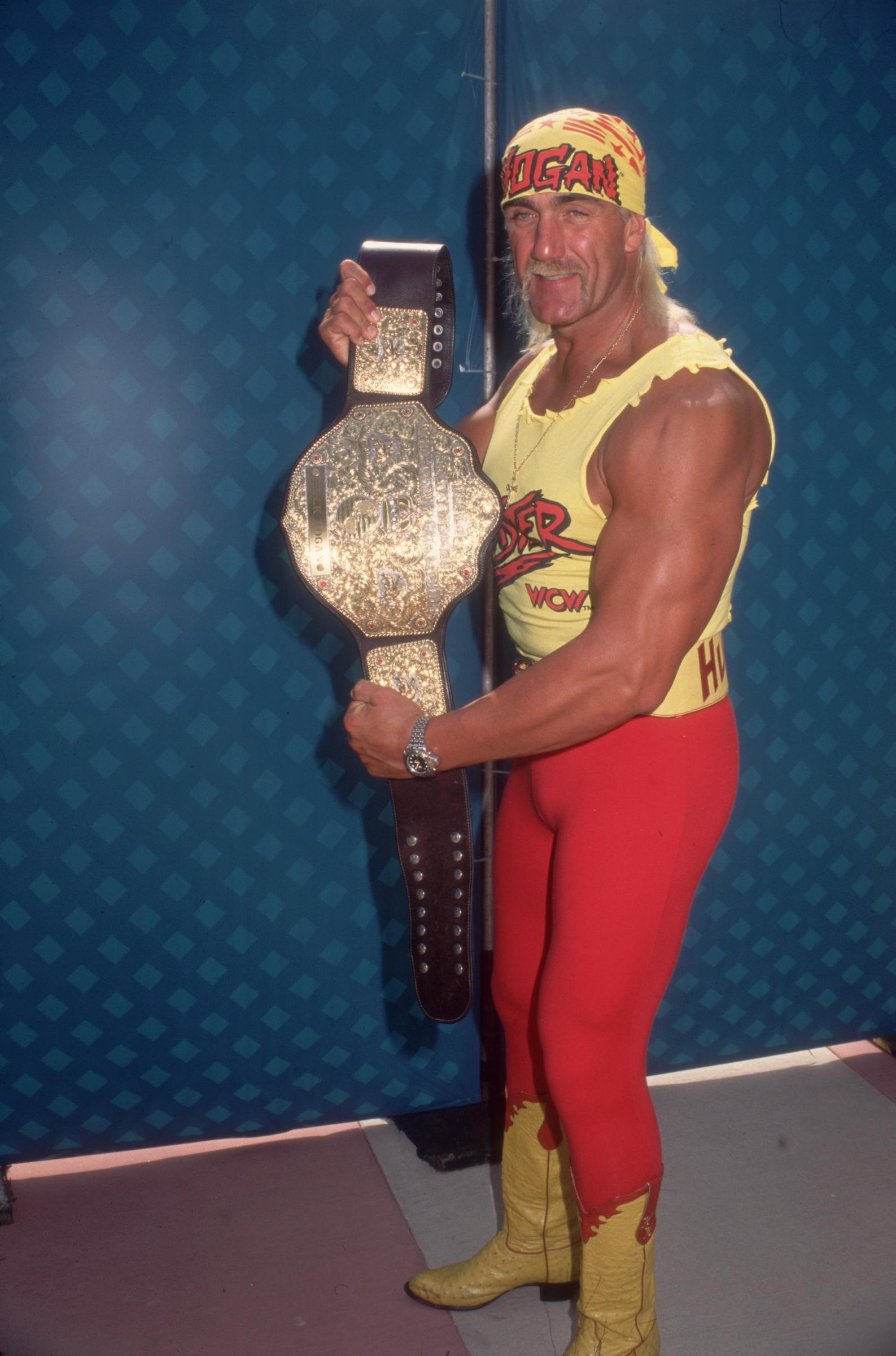 Hulk Hogan displaying his championship belt, circa 1980 | Source: Getty Images