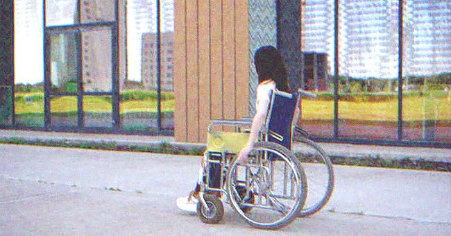 A woman on a wheelchair outdoors. | Source: Shutterstock
