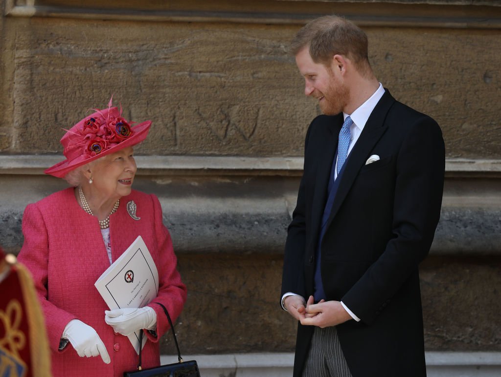 Queen Elizabeth II speaks with Prince Harry, Duke of Sussex as they leave after the wedding of Lady Gabriella Windsor to Thomas Kingston at St George's Chapel, Windsor Castle on May 18, 2019 in Windsor, England | Photo: Getty Images