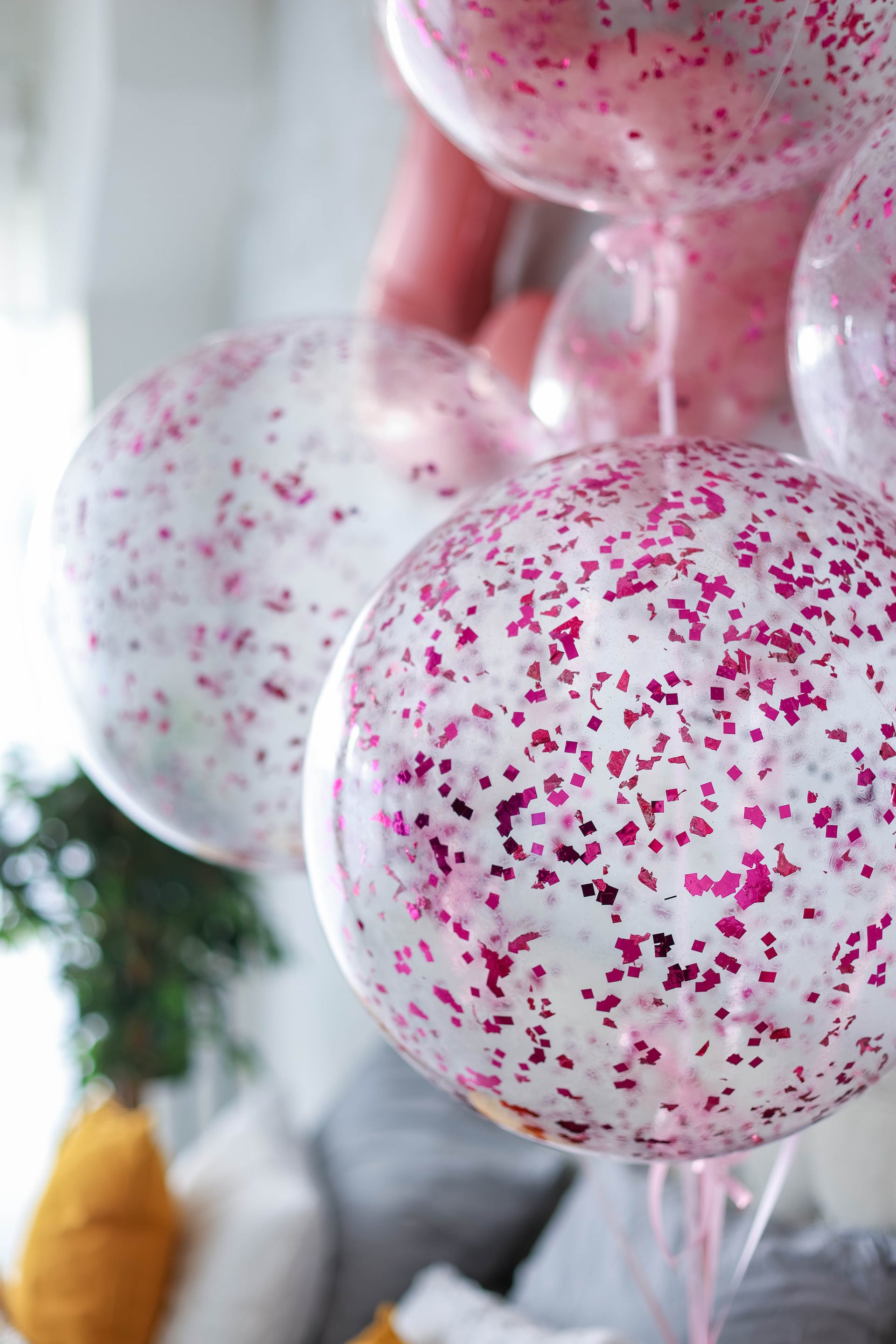 Balloons with pink confetti. | Source: Pexels