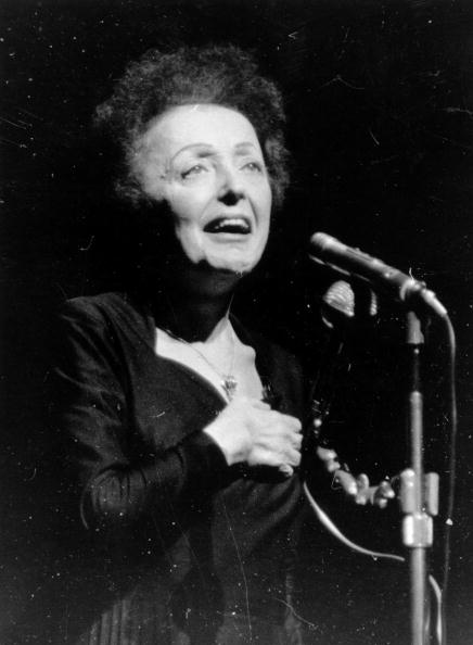 Parisian popular singer Edith Piaf (1915 - 1963), performing at the Olympia, Paris | Photo: Getty Images