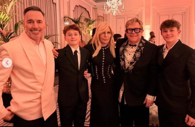 Elton John with husband David Furnish, sons Zachary and Elijah, and Donatella Versace at her New Year's Eve party, as posted on January 1, 2025 | Source: Instagram/eltonjohn