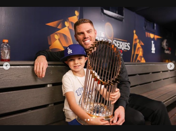 Charles and Freddie Freeman holding the World Series trophy in a photo uploaded on October 31, 2024 | Source: Instagram/chelseafreeman5