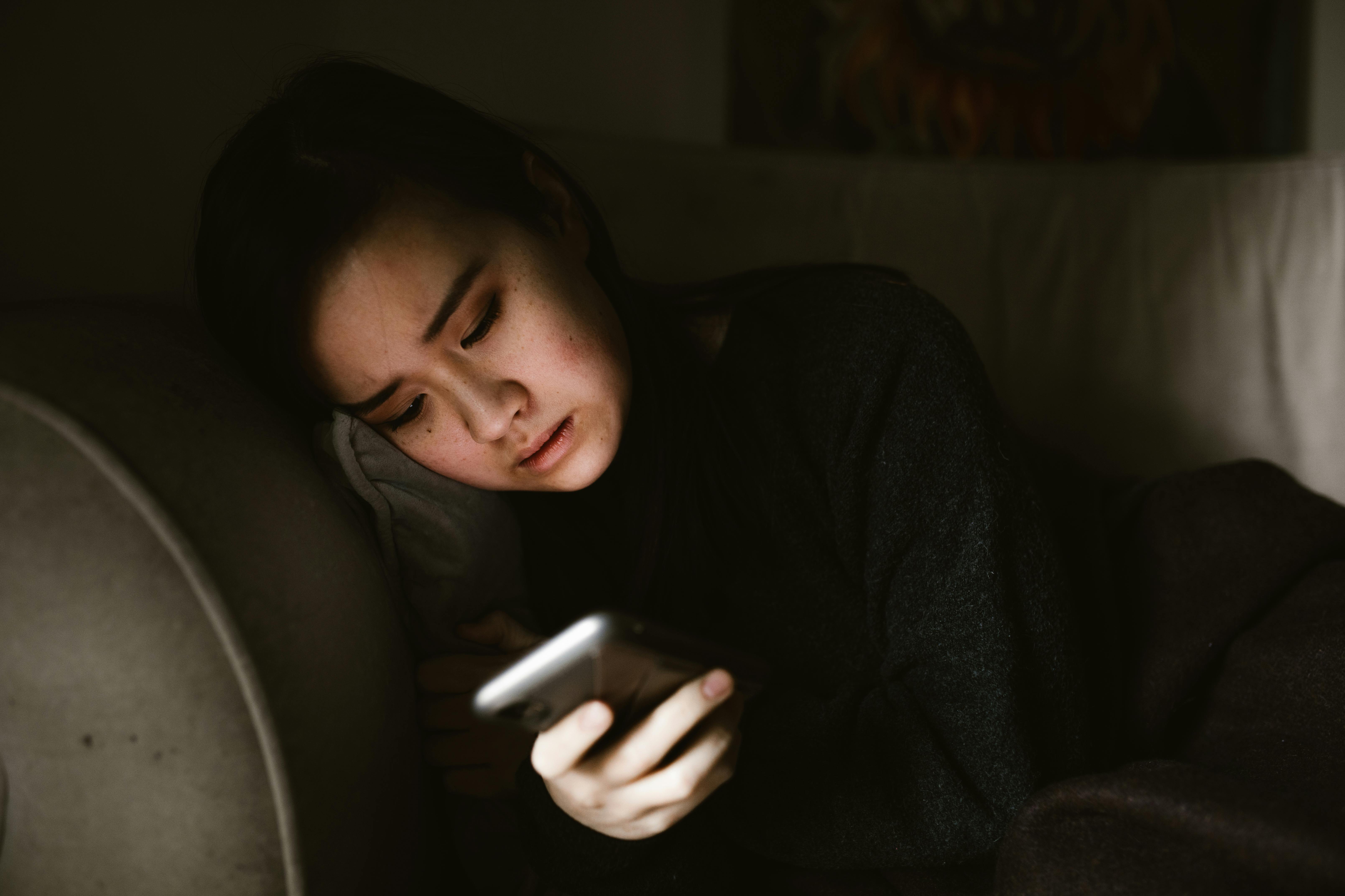 A woman looking at her phone | Source: Pexels