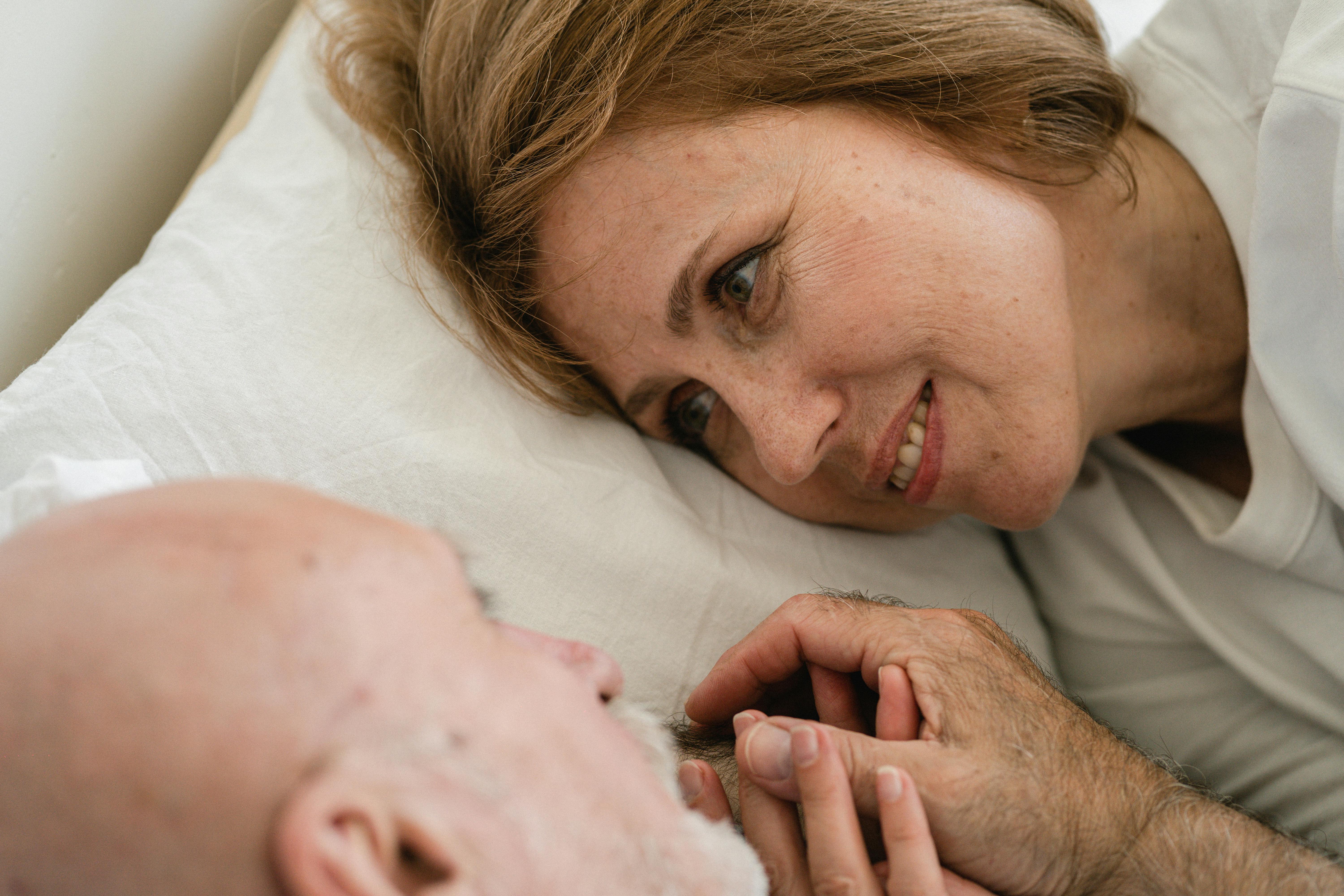 A couple awake in bed | Source: Pexels