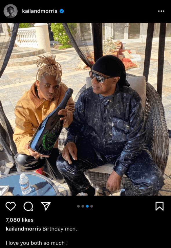 Stevie Wonder and his son, Kailand Morris holding a bottle of champagne. | Photo: instagram.com/kailandmorris