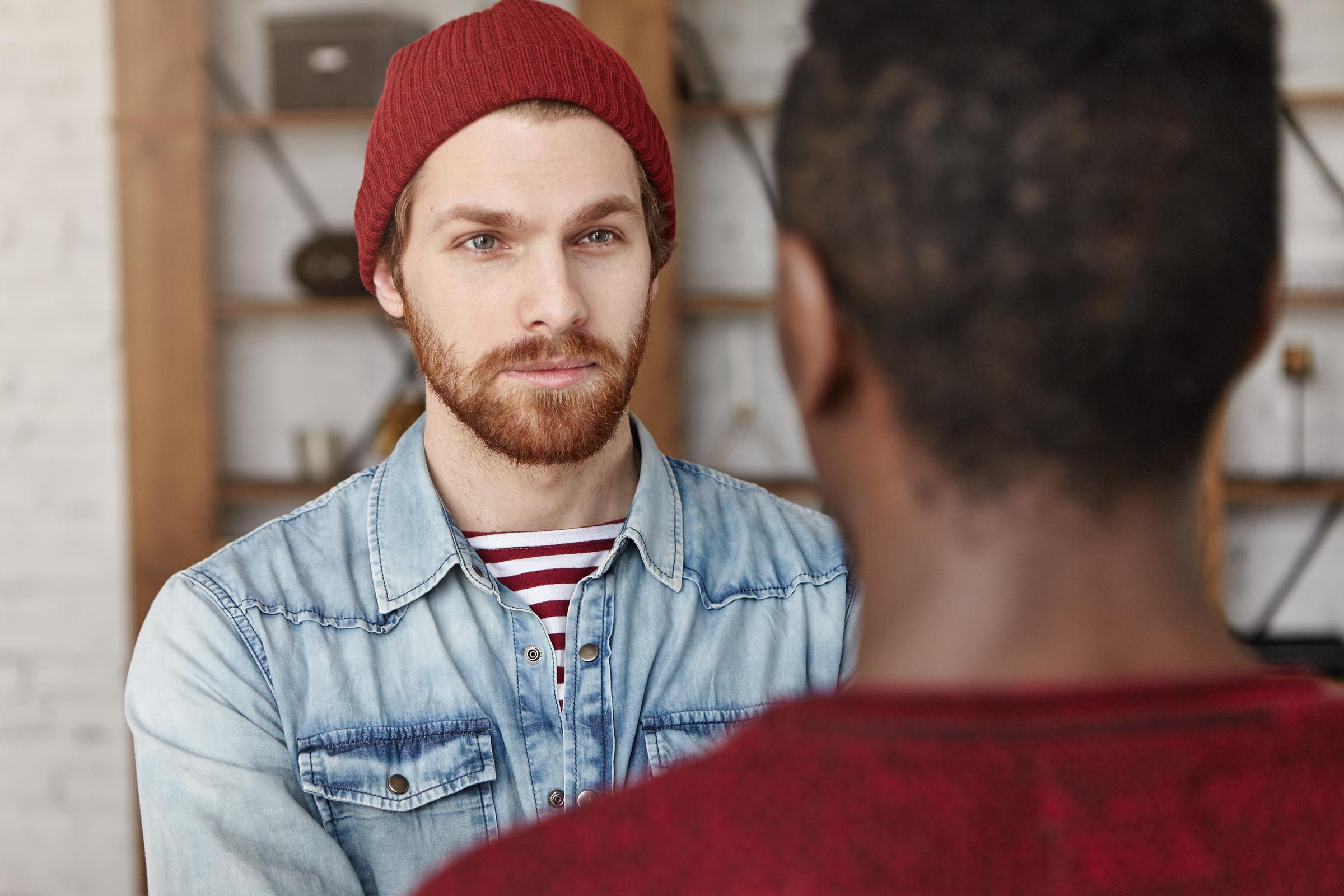 A stern-looking man facing another man | Source: Freepik