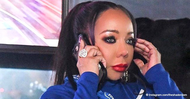 Tiny Harris drops jaws, looking youthful in high ponytail and blue dress in recent photo