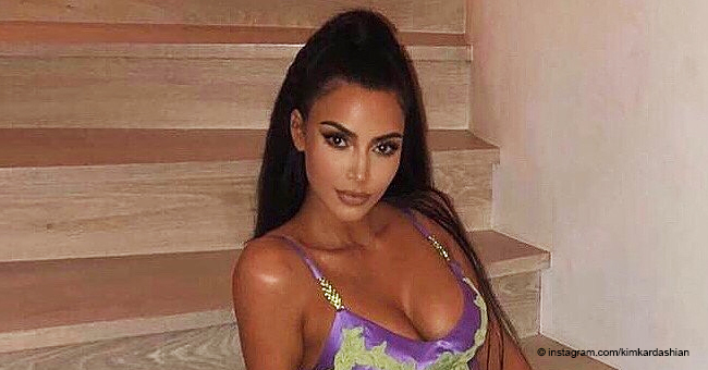 Kim Kardashian Flaunts Ample Cleavage in Neon Vintage Dress Baring Her Legs through a Thigh Split