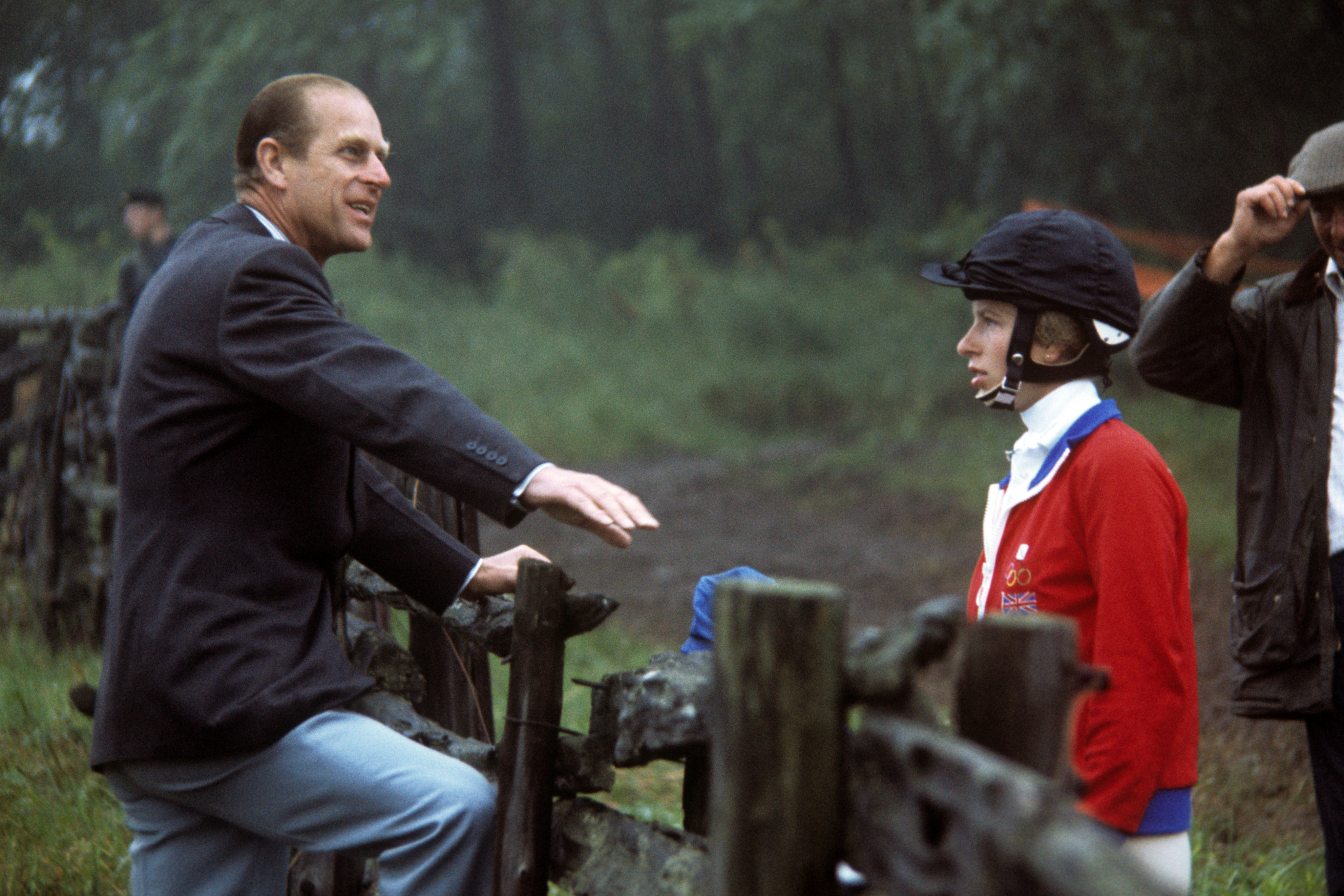 Princess Anne talking to her father, Prince Phillip at Bromont, Canada, during the Montreal Olympic Games in 1976. | Source: Getty Images