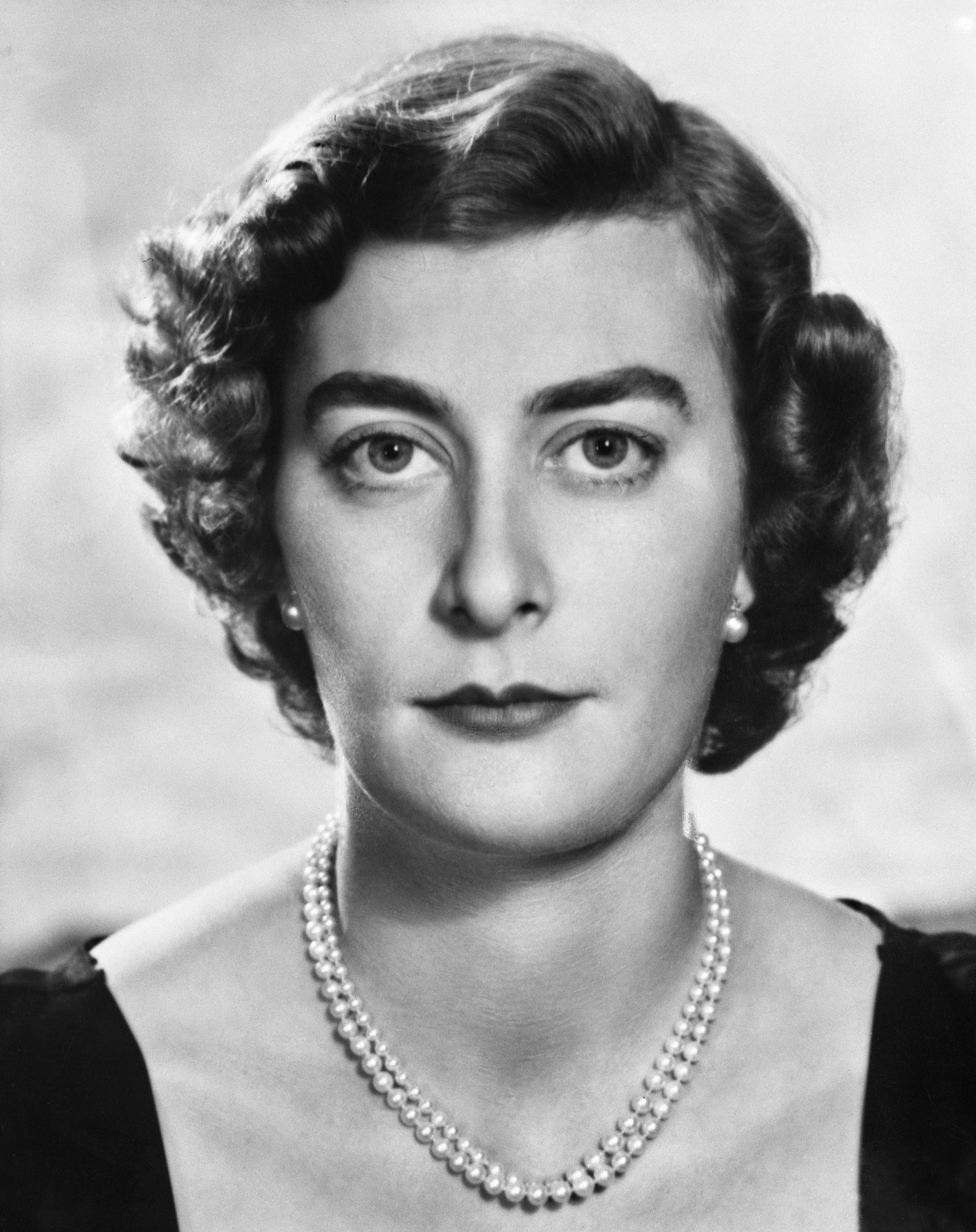 This striking 1953 portrait captures Lady Pamela Mountbatten in close detail, her composed expression, softly styled hair, and classic pearl necklace reflecting the understated elegance and poise that defined her presence during the early years of Queen Elizabeth II's reign.