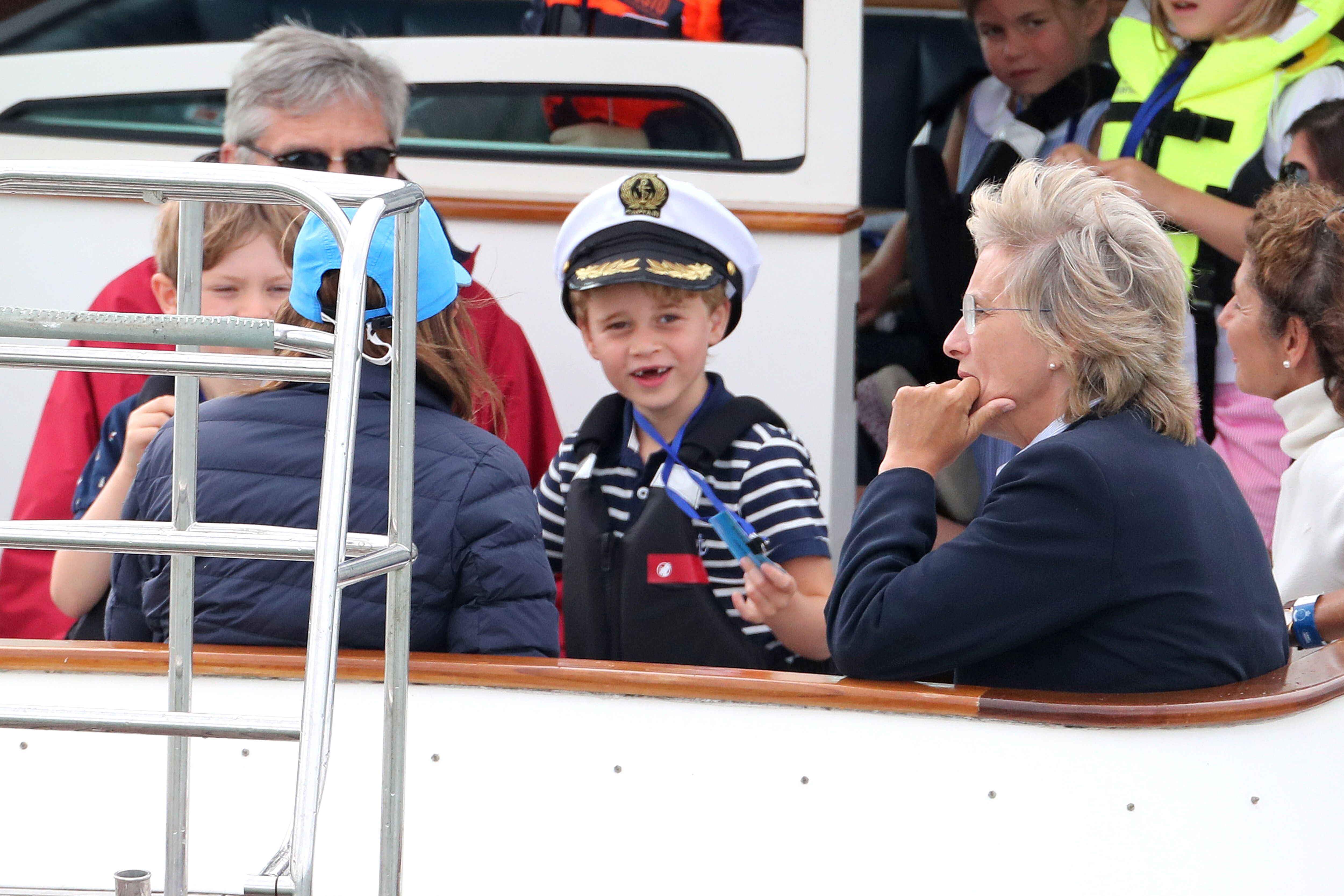 Prince George flashes a wide smile at the King's Cup Regatta. | Source: Getty Images