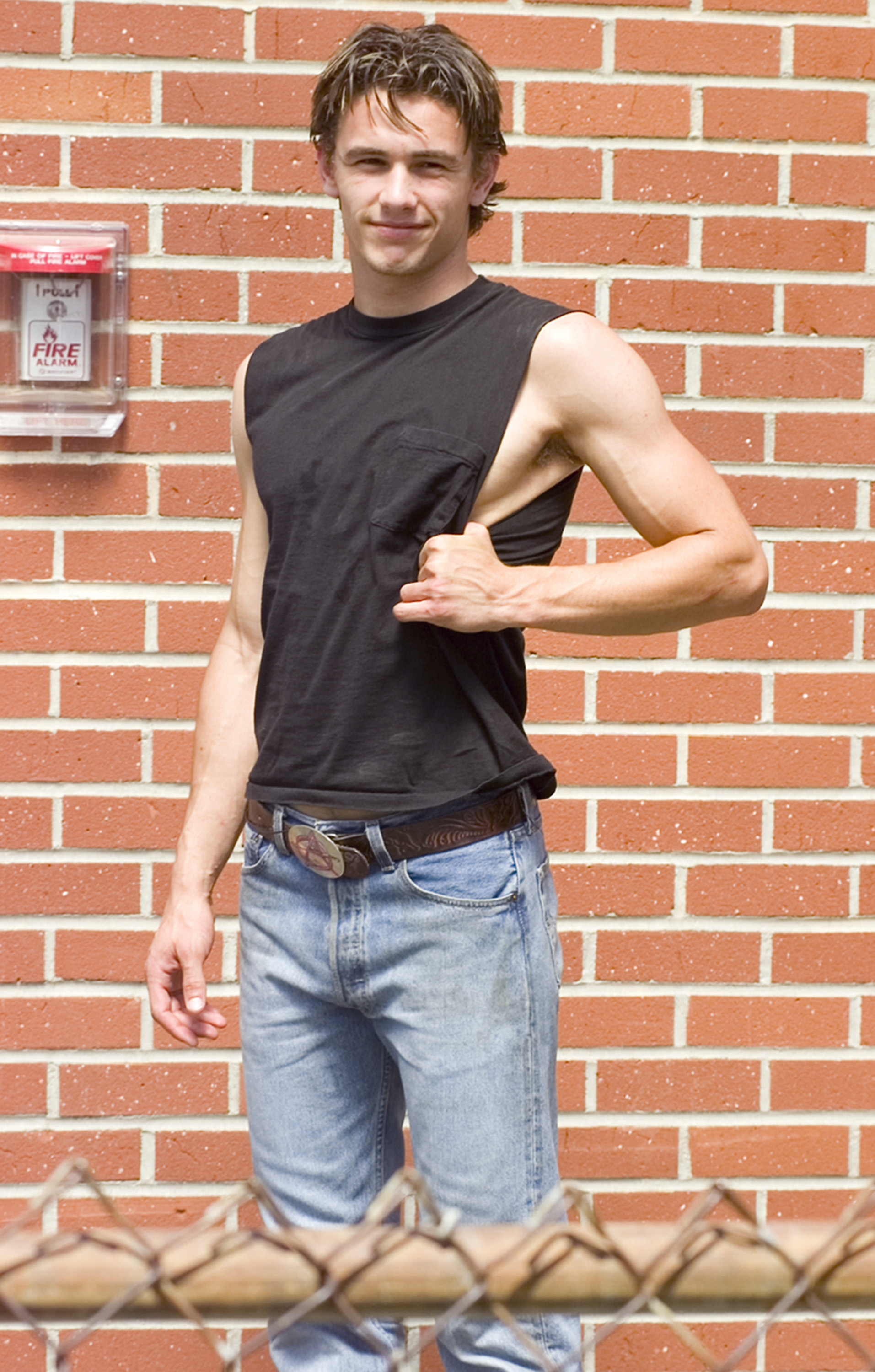 As Daniel Desario in "Freaks and Geeks," James Franco leans coolly against a brick wall in a cut-off tee and jeans. This early role captured his laid-back edge and helped launch his acting career.