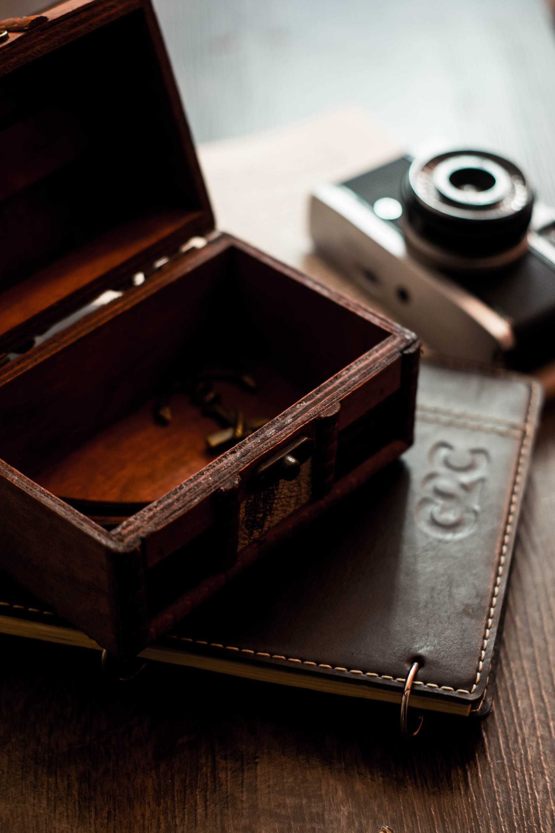 Wooden box and notebook | Source: Pexels