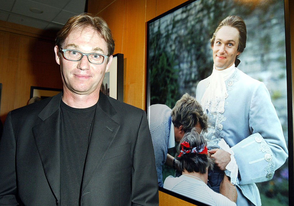 Richard Thomas poses in front of his portrait taken by photographer Pat York on September 12, 2003 in Beverly Hills, California. | Source: Getty Images