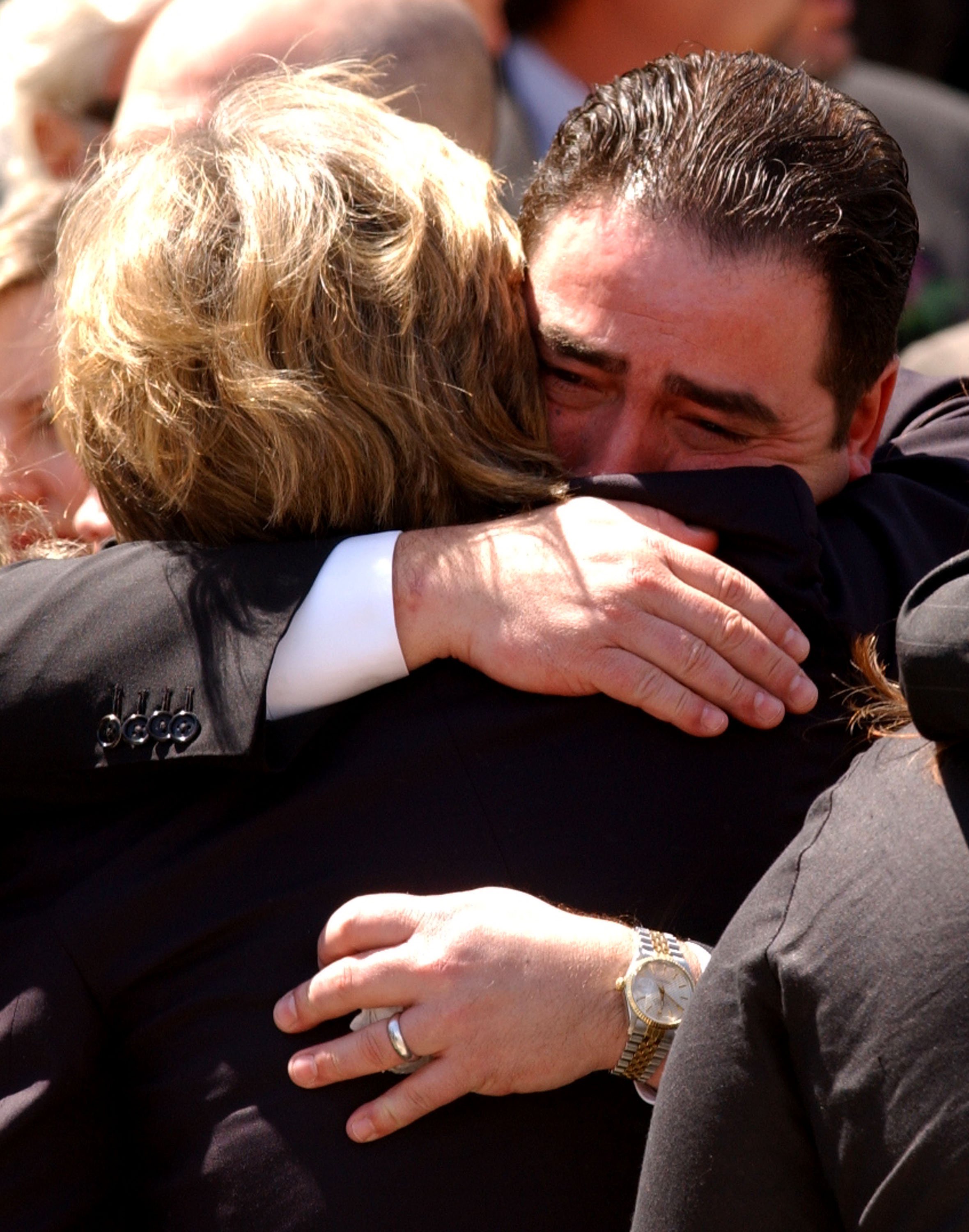 Heather Menzies is comforted by Emeril Lagasse after Robert Urich's funeral, April 19, 2002. |  Source: Getty Images