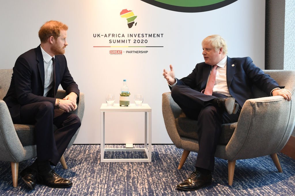 Prince Harry, Duke of Sussex, speaks with British Prime Minister Boris Johnson as they attend the UK-Africa Investment Summit at the Intercontinental Hotel in London, England | Photo: Getty Images