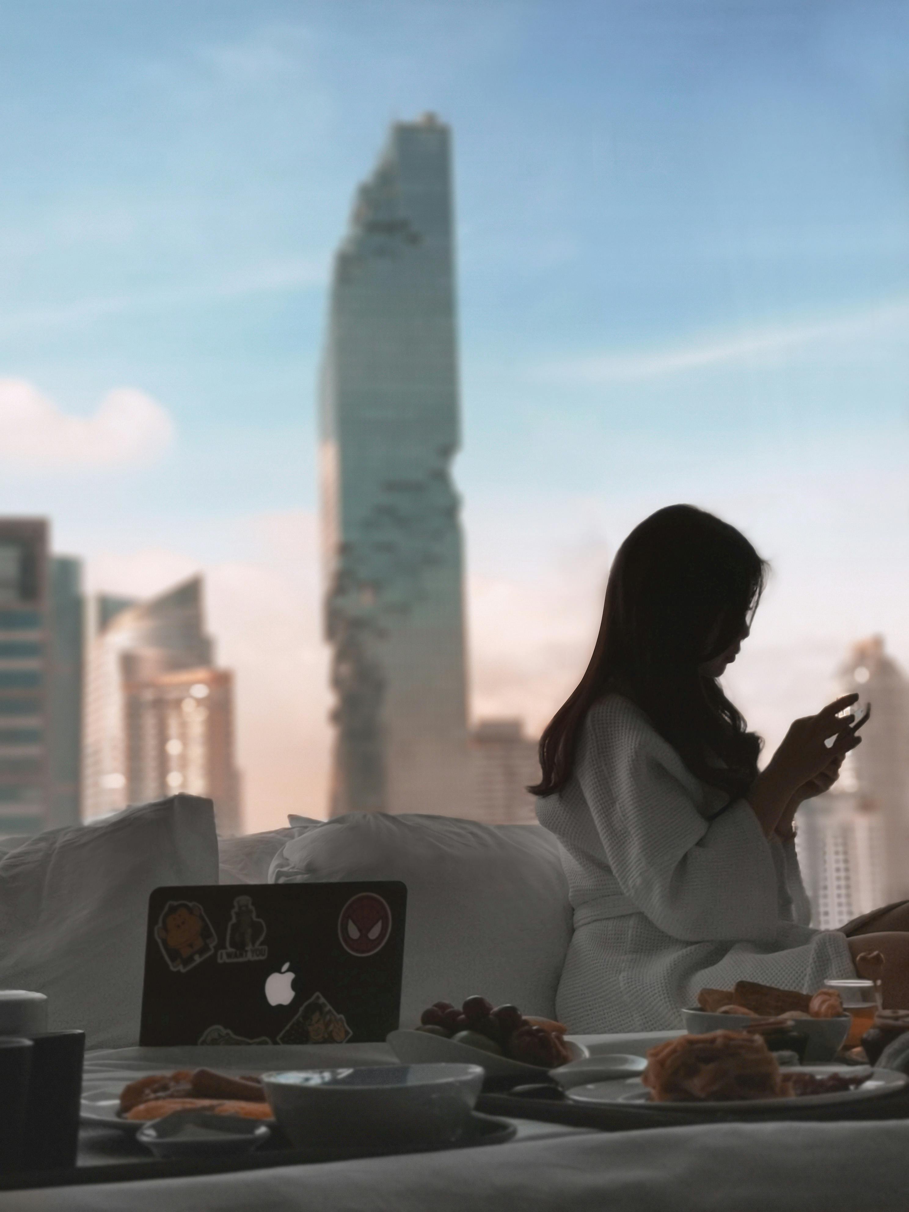 Woman relaxing in a hotel room | Source: Pexels