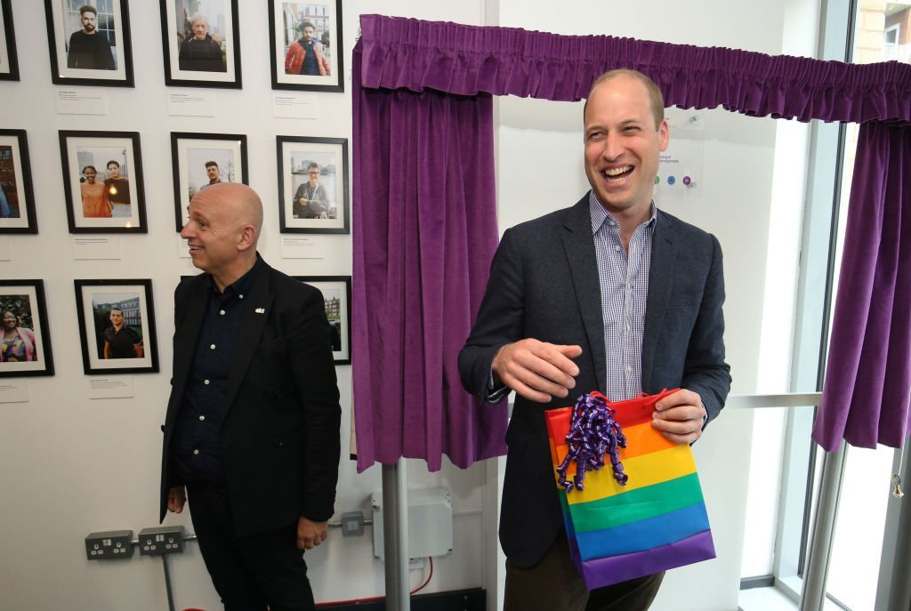 Prince William, Duke of Cambridge receives a gift bag from trust chief executive officer Tim Sigsworth as he visits the Albert Kennedy Trust | Photo: Getty Images