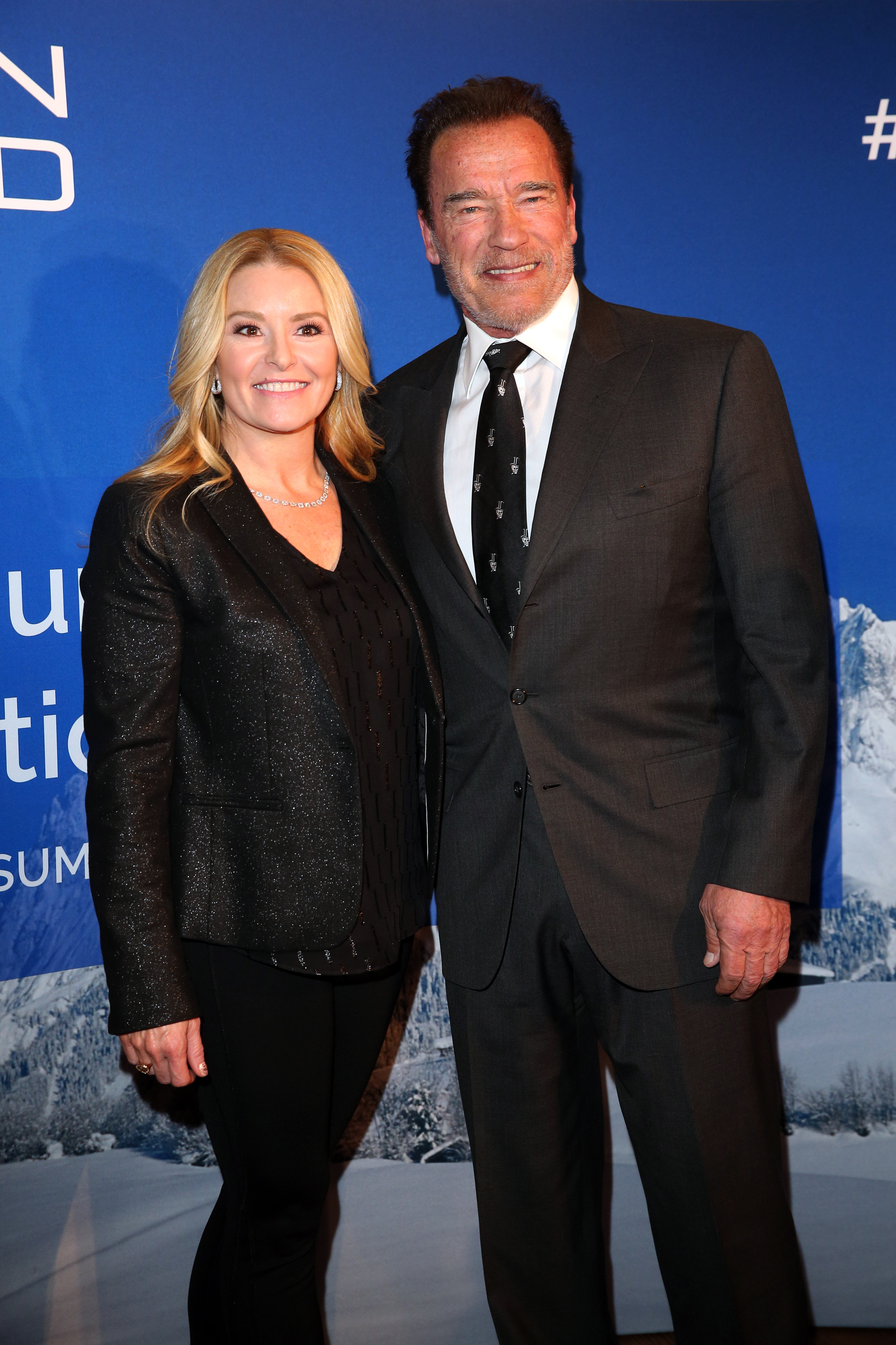 Arnold Schwarzenegger and his girlfriend Heather Milligan on January 23, 2020 in Kitzbuehel, Austria | Source: Getty Images