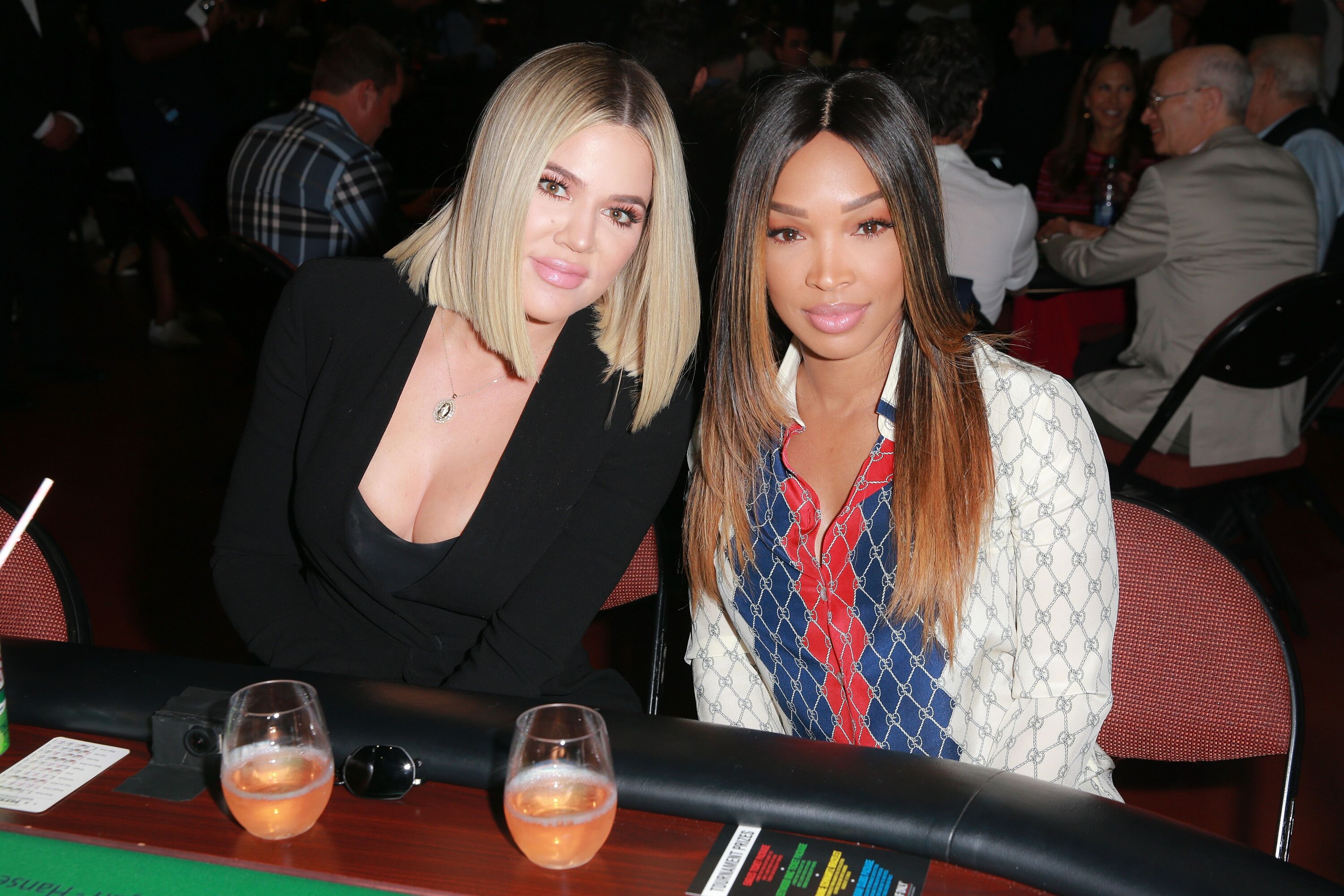 Actress Malika Haqq with her celebrity BFF Khloé Kardashian at a charity poker tournament in 2018/ Source: Getty Images