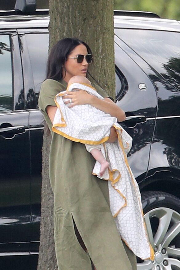 Meghan Markle cradles baby Archie. | Source: Getty Images