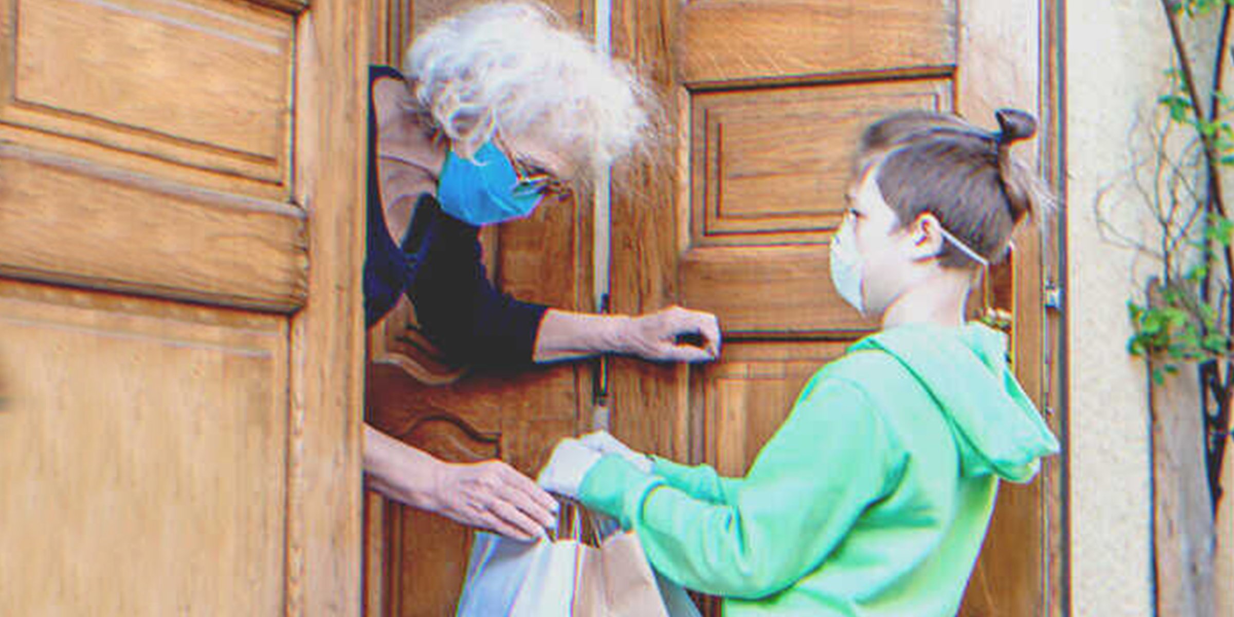 Boy delivering groceries to an old lady | Source: Shutterstock