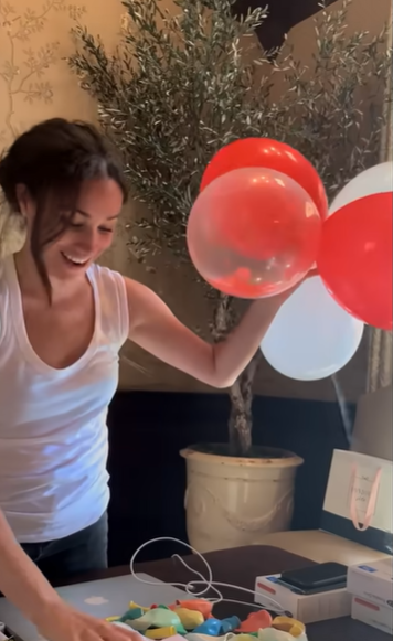Meghan Markle preparing balloons at home in a video shared on December 12, 2022 | Source: YouTube/Netflix