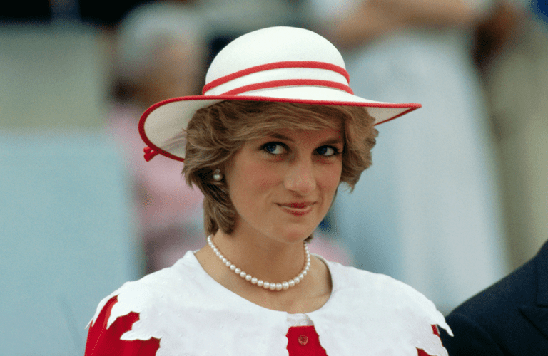 Diana, Princess of Wales, wears an outfit in the colors of Canada during a state visit to Edmonton, Alberta, with her husband. | Source: Getty Images