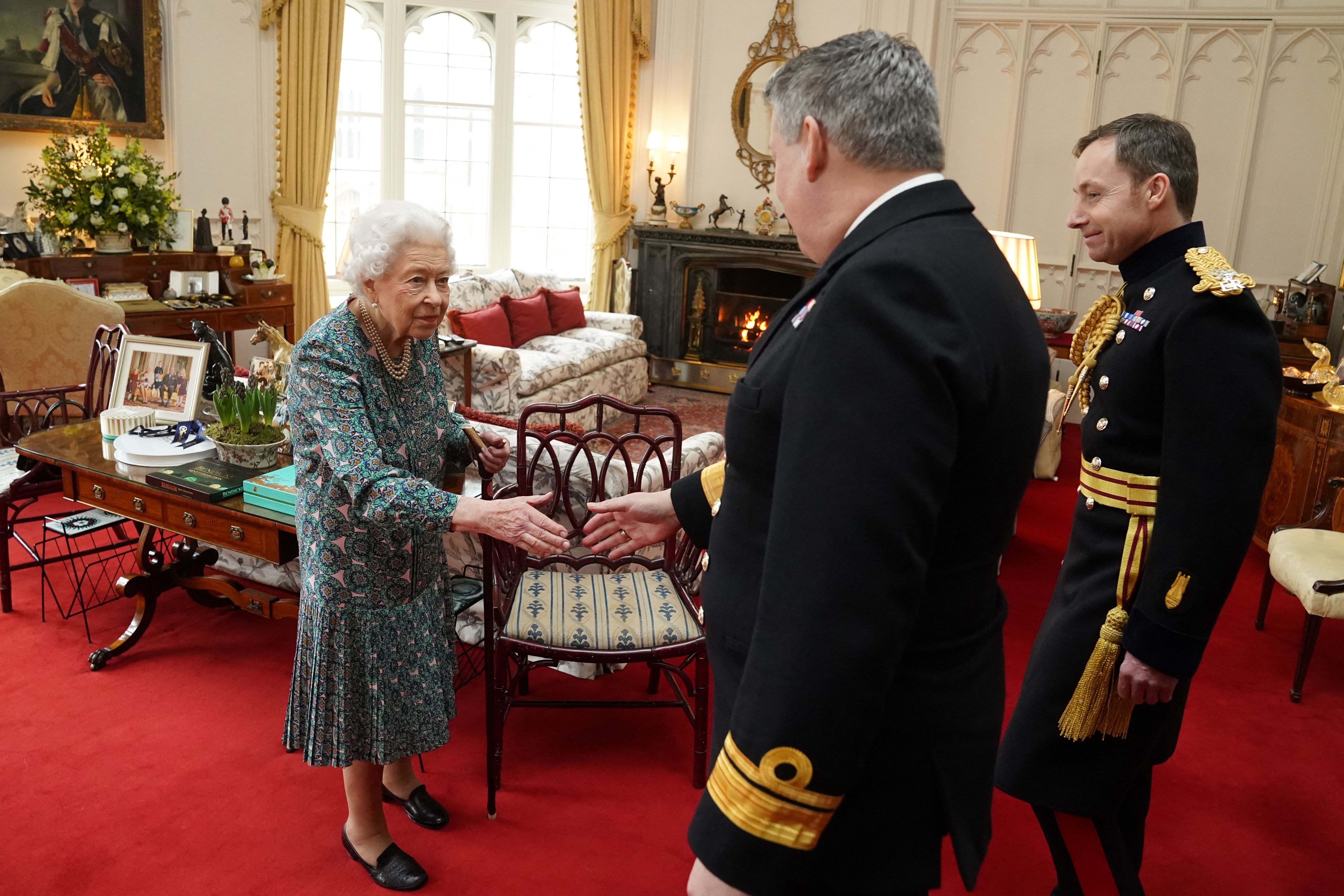 Queen Elizabeth II welcomed outgoing Defence Service Secretaries Rear Admiral James Macleod and incoming Defence Service Secretaries Major General Eldon Millar at the Windsor Castle, in Windsor, on February 16, 2022. | Source: Getty Images